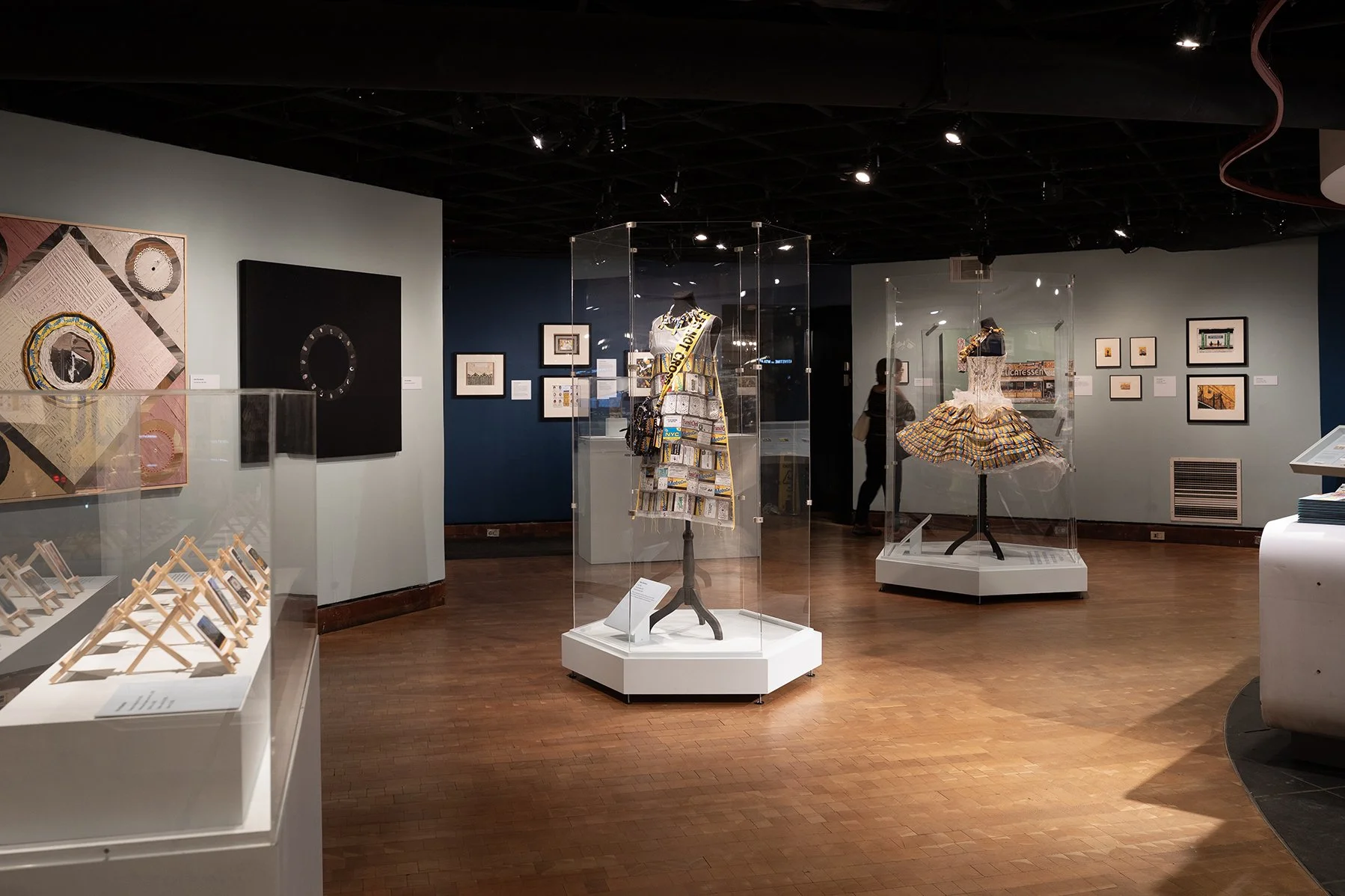 Gallery overview of large and small paintings, collages, sculptures, and dresses using MetroCards as a medium