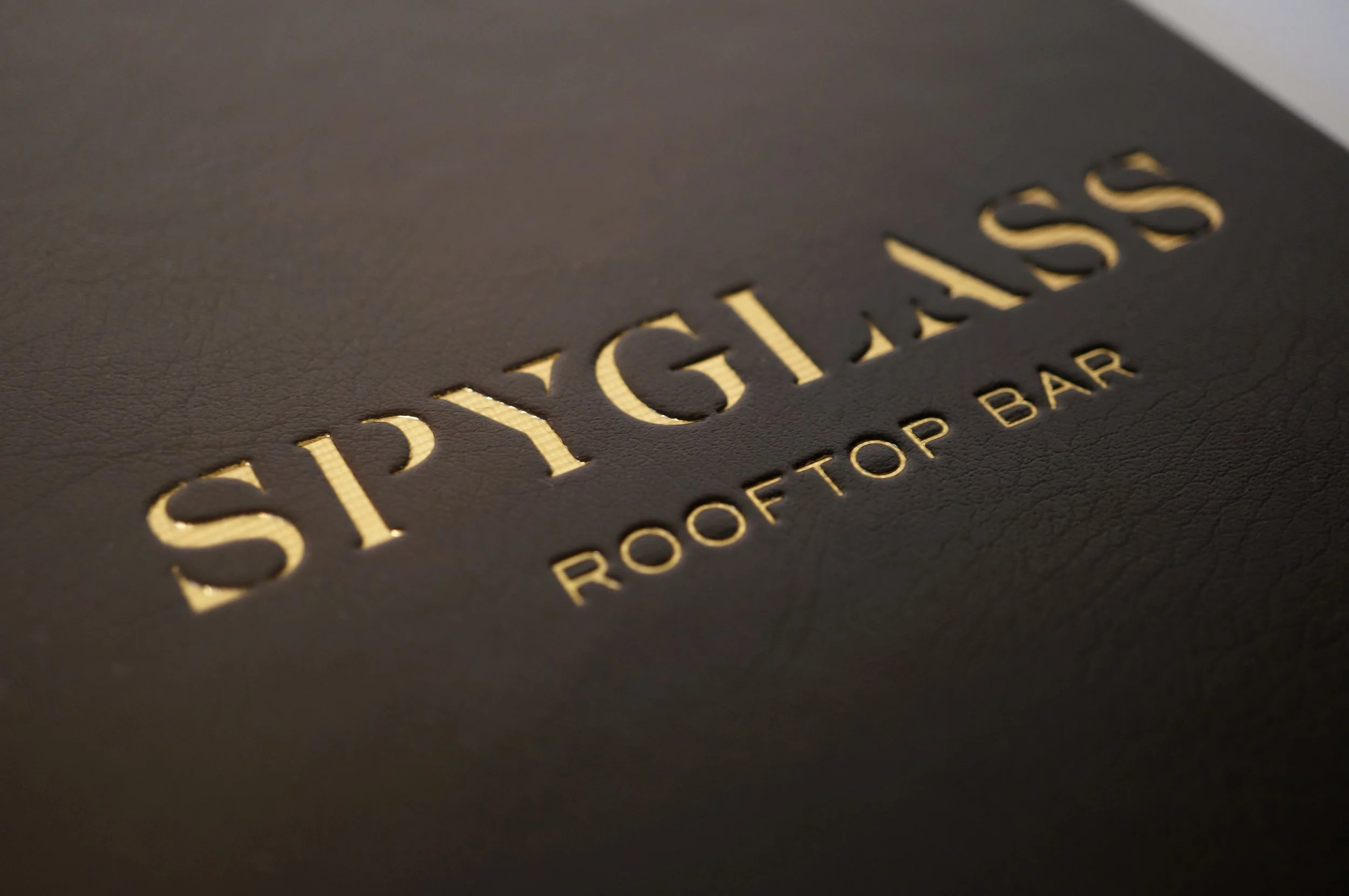 SpyglassMenu_Cover_EmbossDetail.JPG