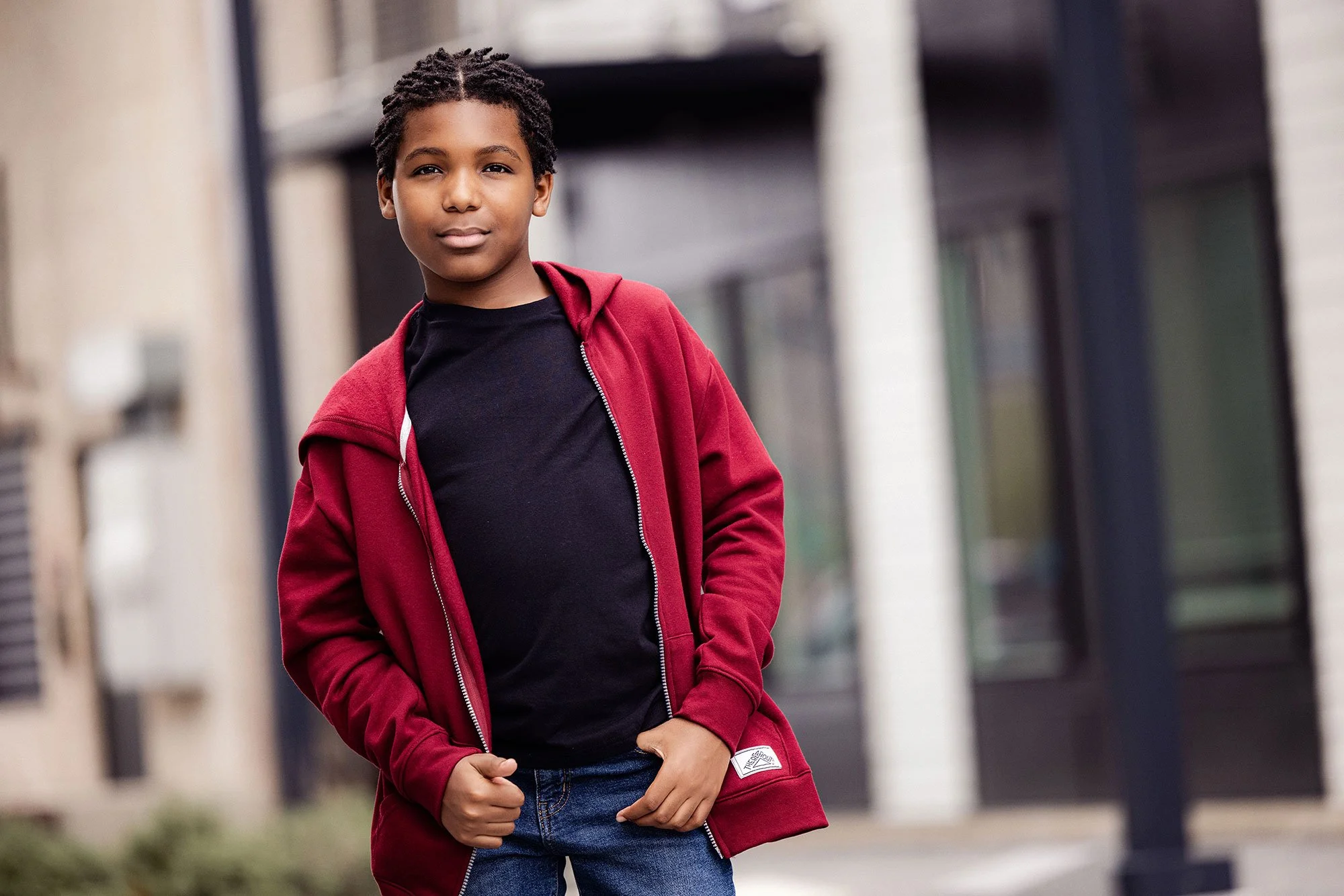 Young male black model wearing red hoodie