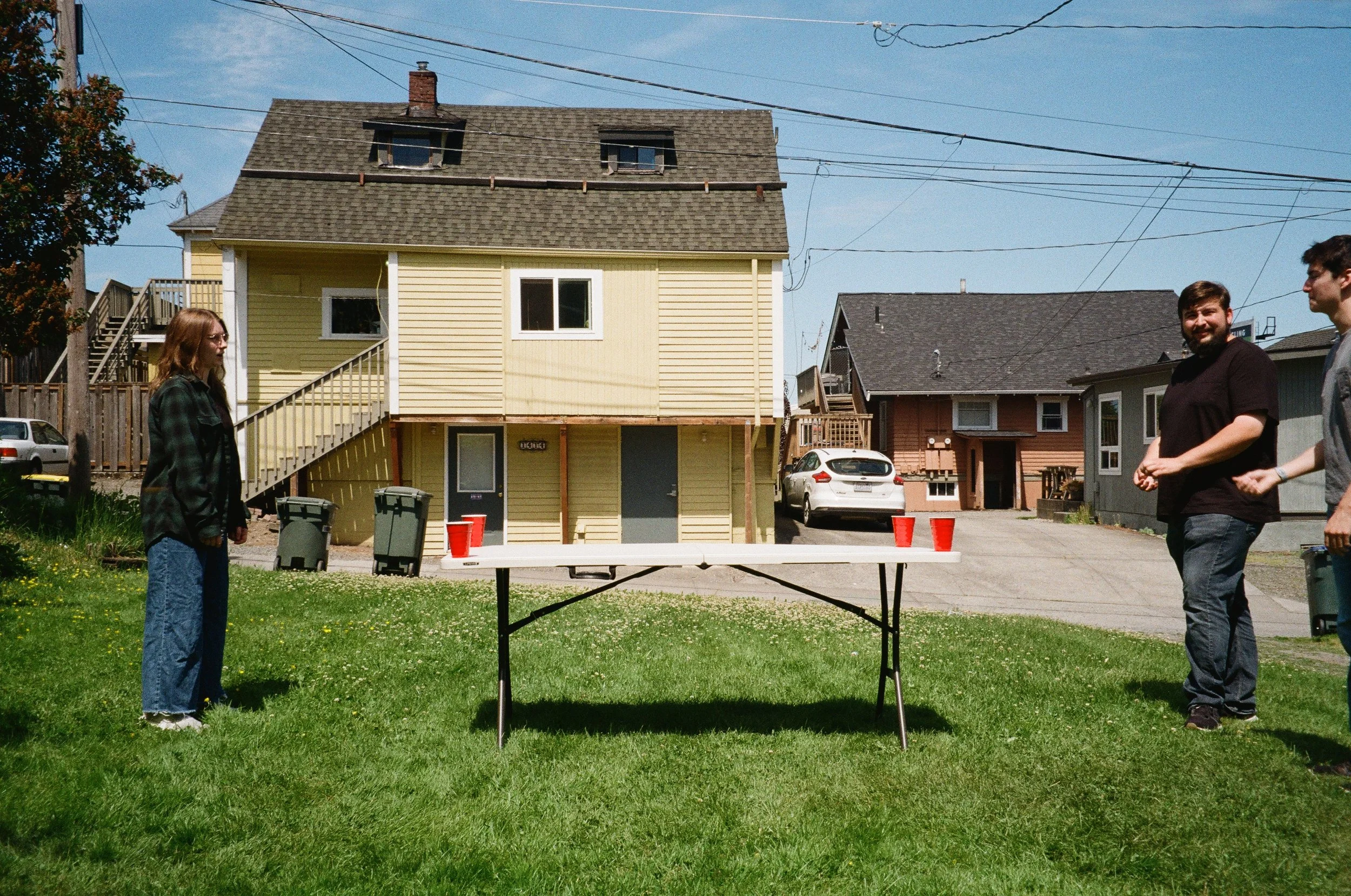 Lydia Biggs, Jackson Freund and Jackson Wang play a game of beer dye in Bellingham, Wash.