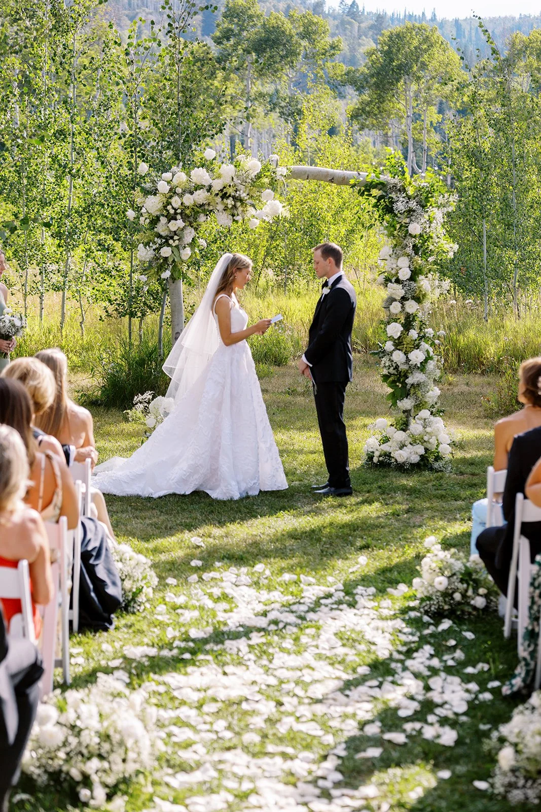 aspen grove wedding, white wedding arch, birch wood arch, steamboat springs florist