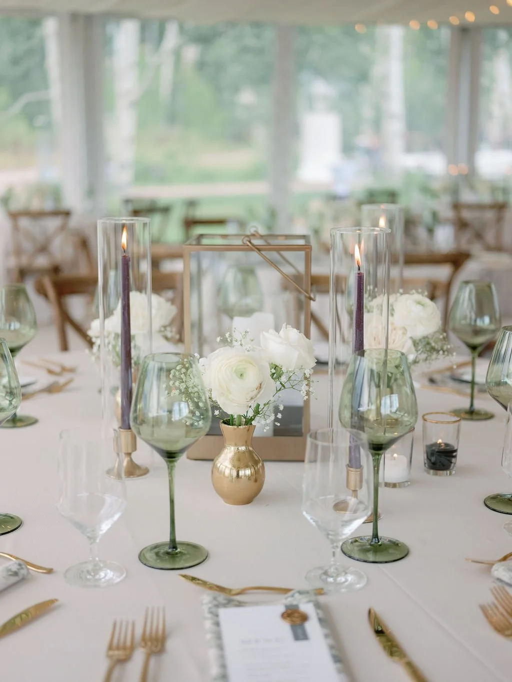 gold lantern centerpiece with black taper candle