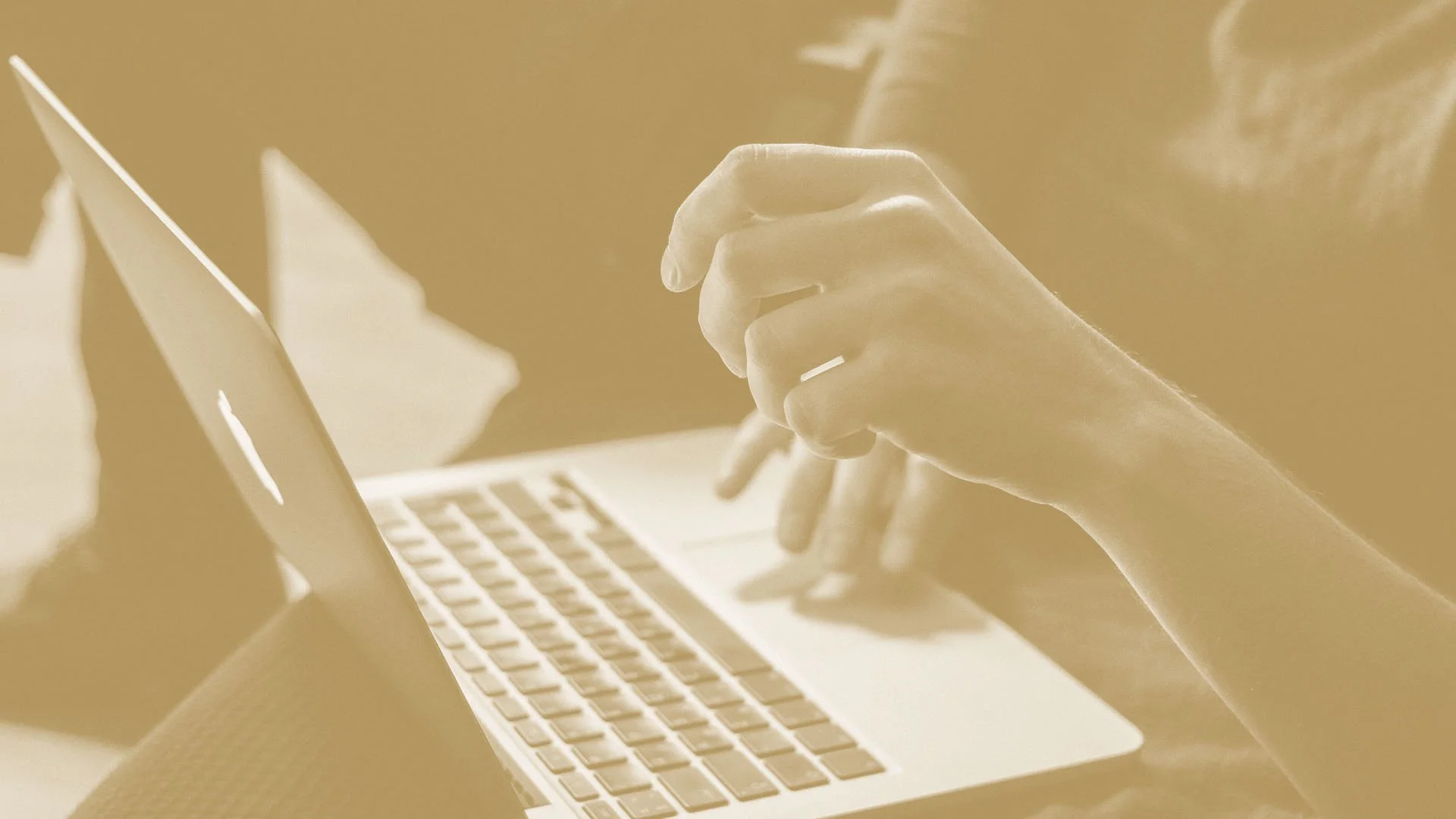 Computer with hands typing