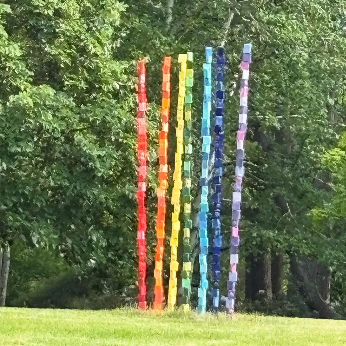 SPIRIT is a group of 7&rsquo; totems representing a rainbow; they are installed at Dow Gardens near the Children&rsquo;s area. It stands on a hill and is visible from several garden paths close or far away, eye-catching and colorful. 

The second pho