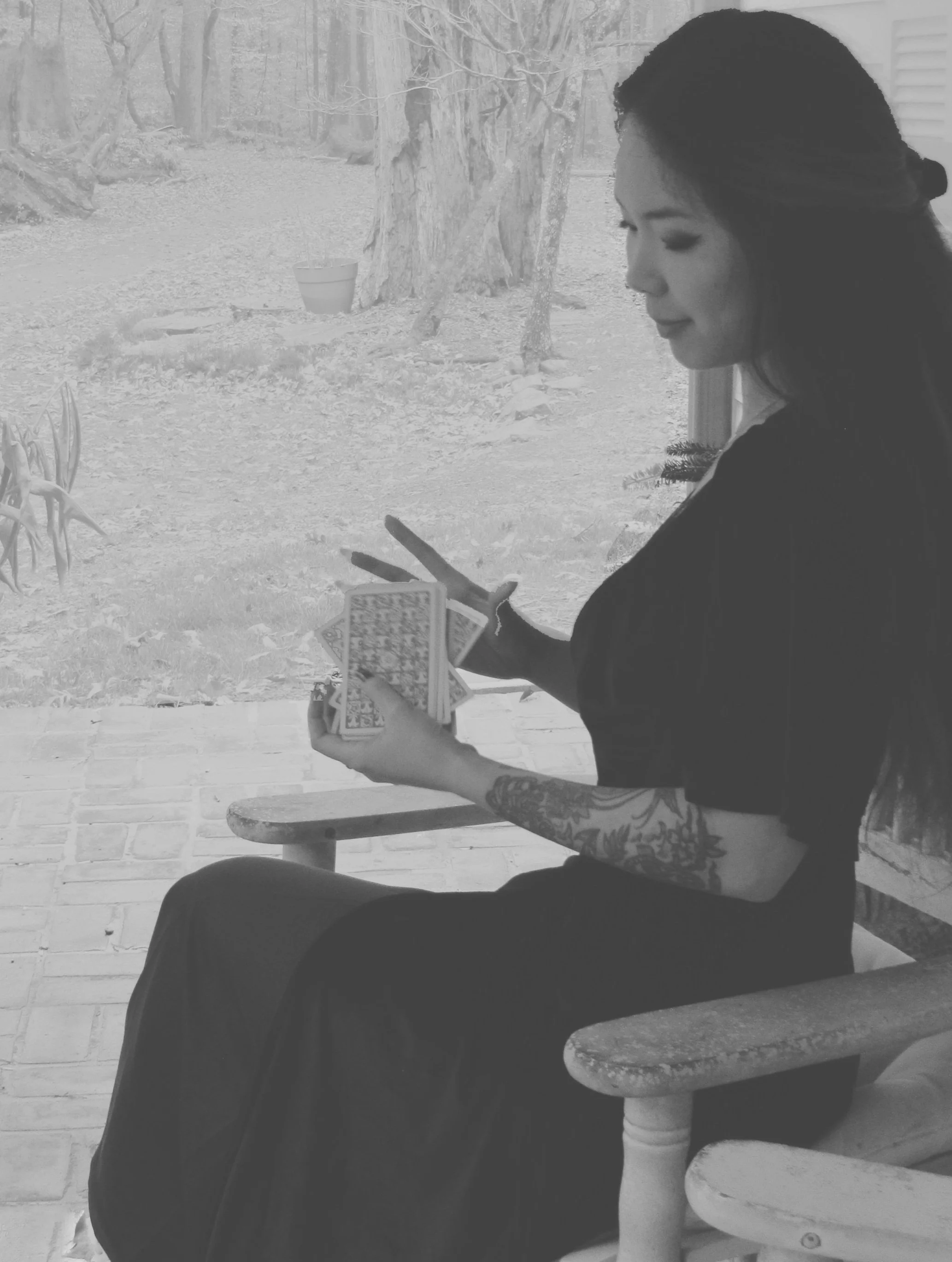 reader shuffling tarot cards whimsygoth southern gothic aesthetic