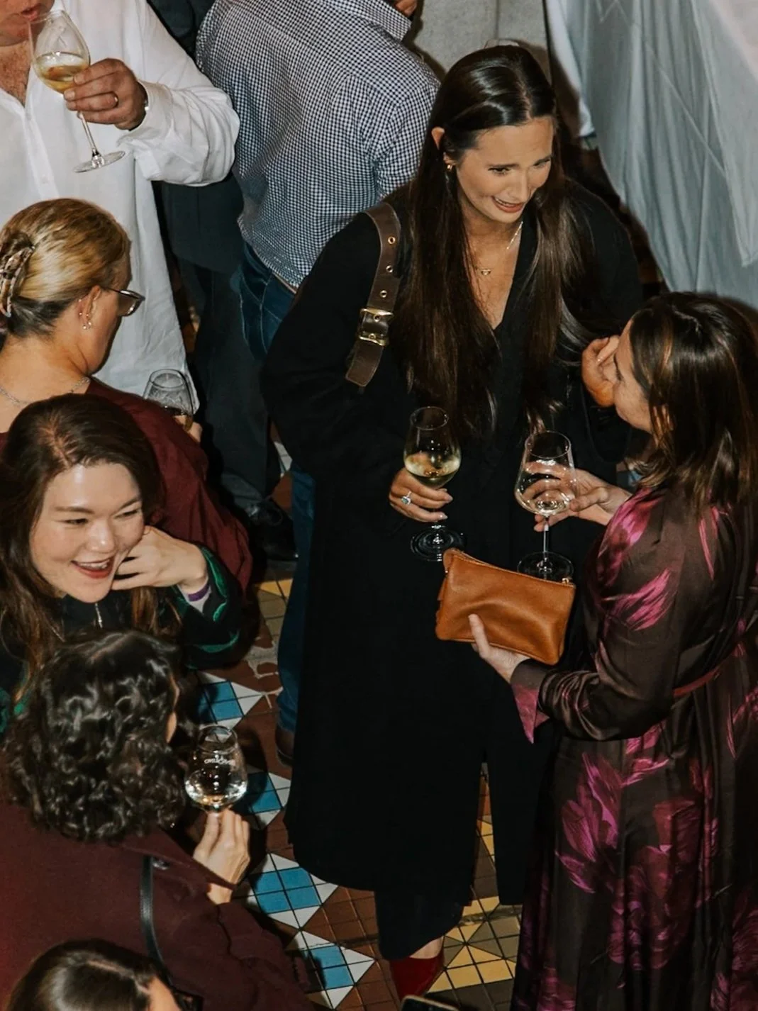 Guests mingling with drinks during a canapé and cocktail event at Pendolino in Sydney CBD.