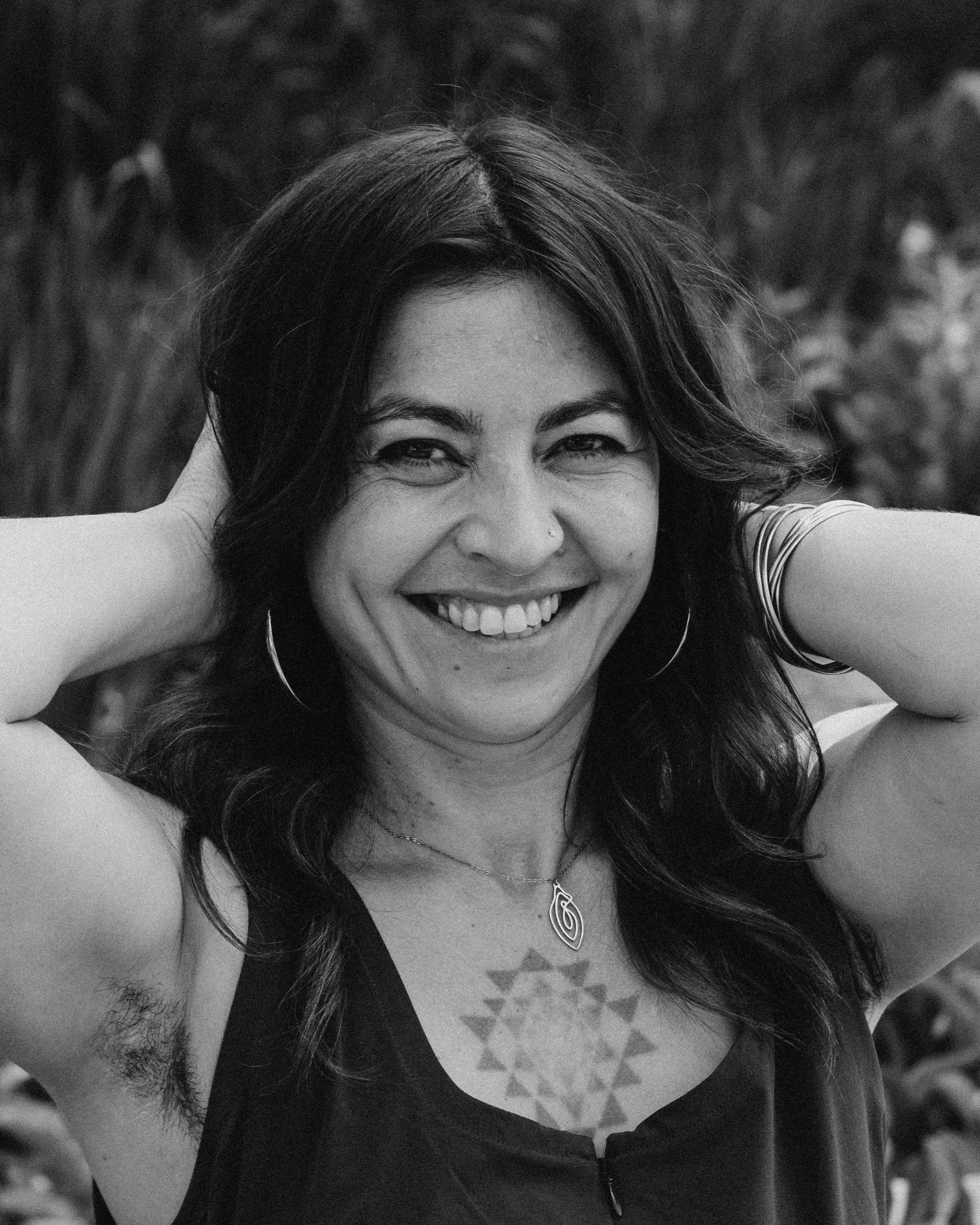 Close-up black and white photo of Zhenya Novareign, sex coach and maya abdominal massage practitioner in Albuquerque, New Mexico.