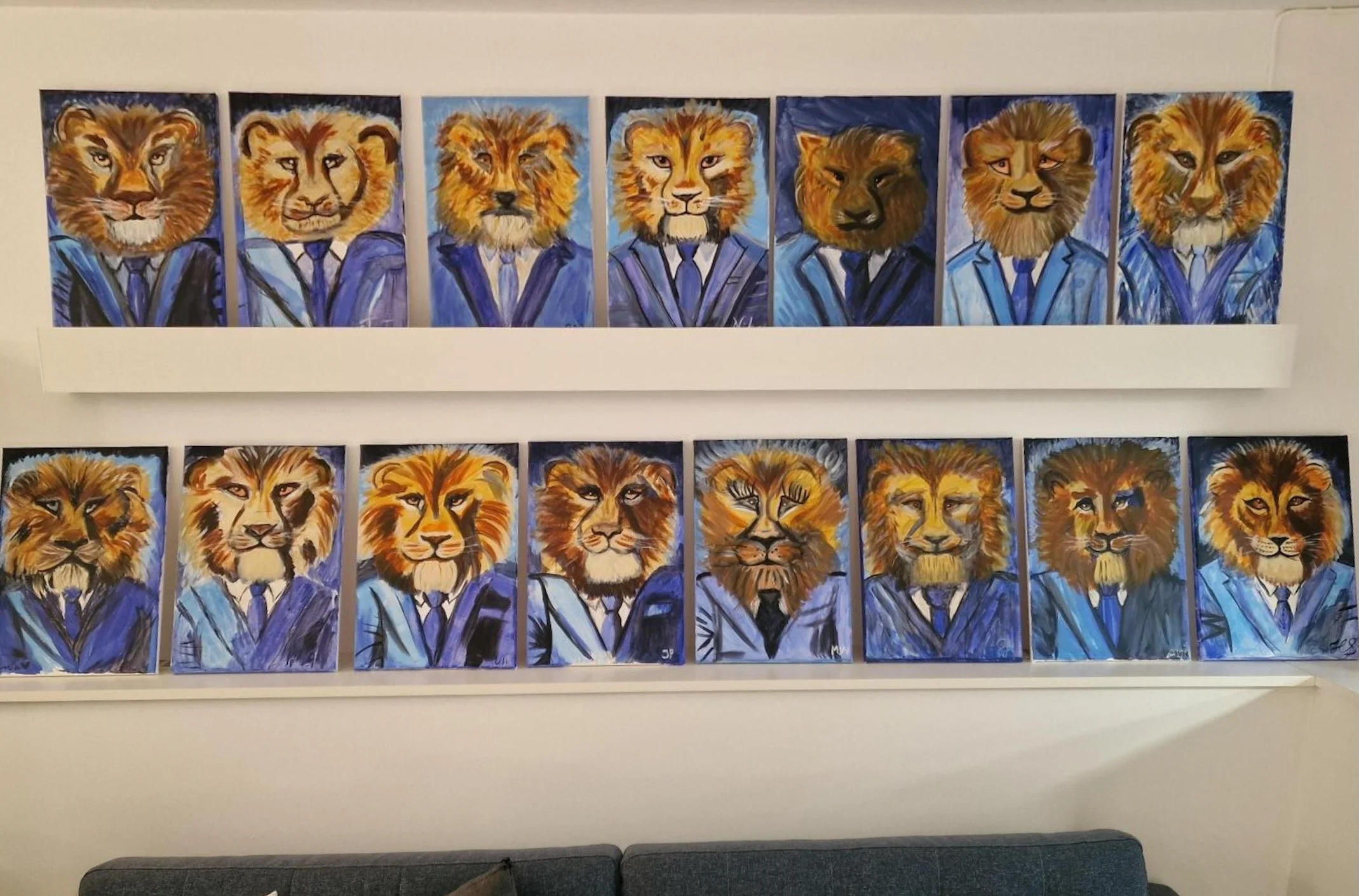 staff paintings after paint party malmö team building experience of the lion mascot in publicis sapient hanging in their office