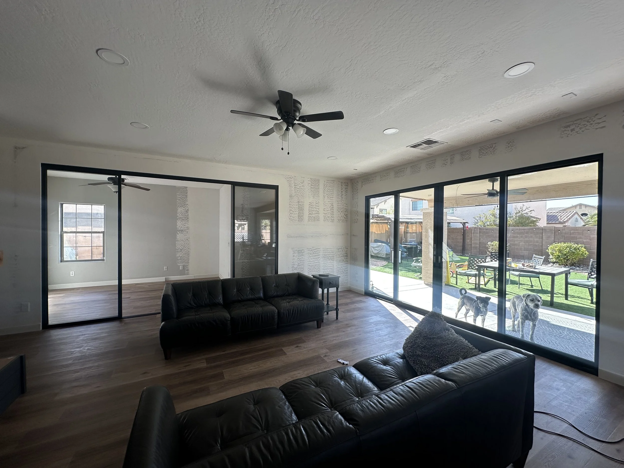 A Living room with a custom door from Western Window Systems and an interior slider from a living room remodel