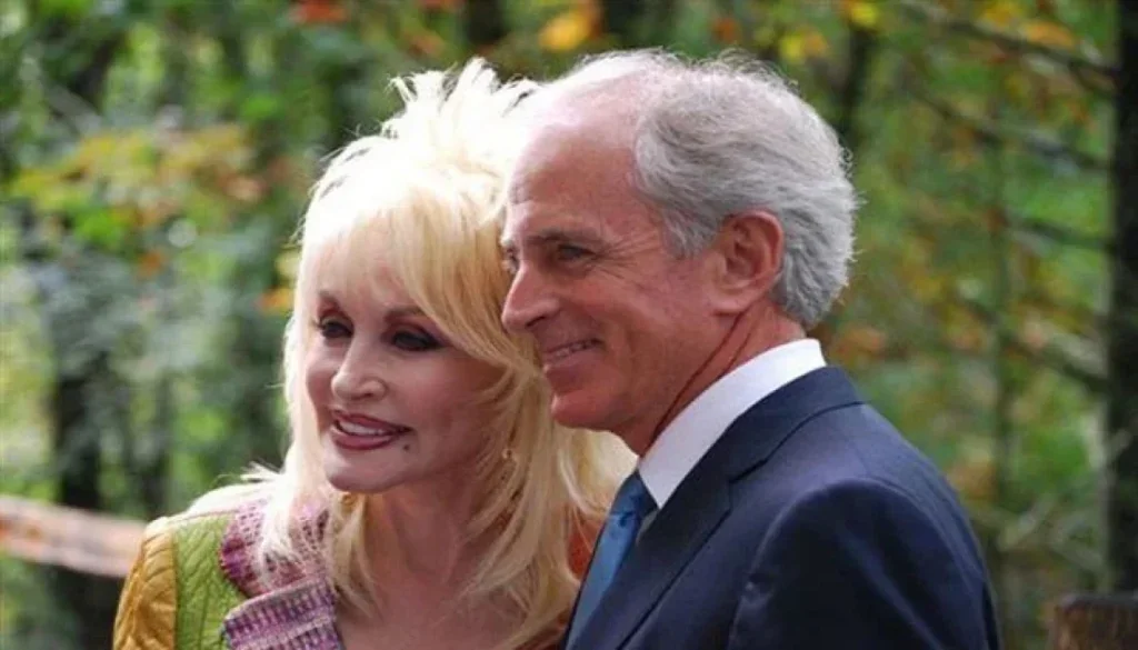 Dolly Parton and Carl Dean smiling together in a rare joint photo.