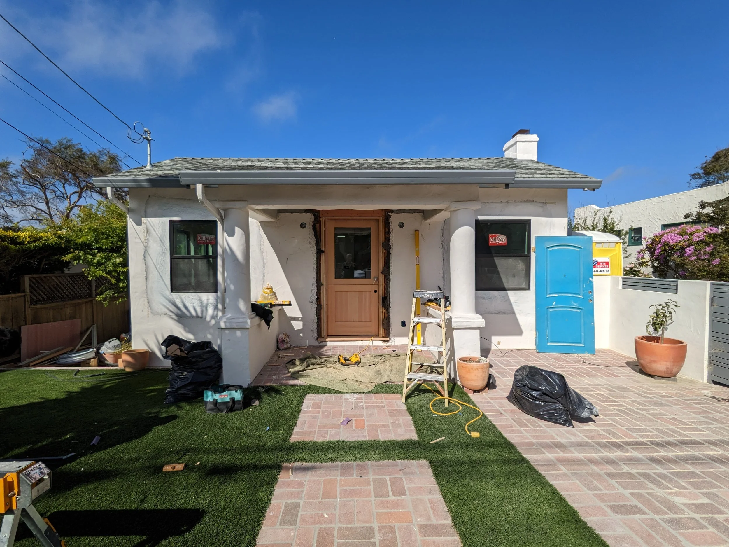 New windows, doors, and front yard. 