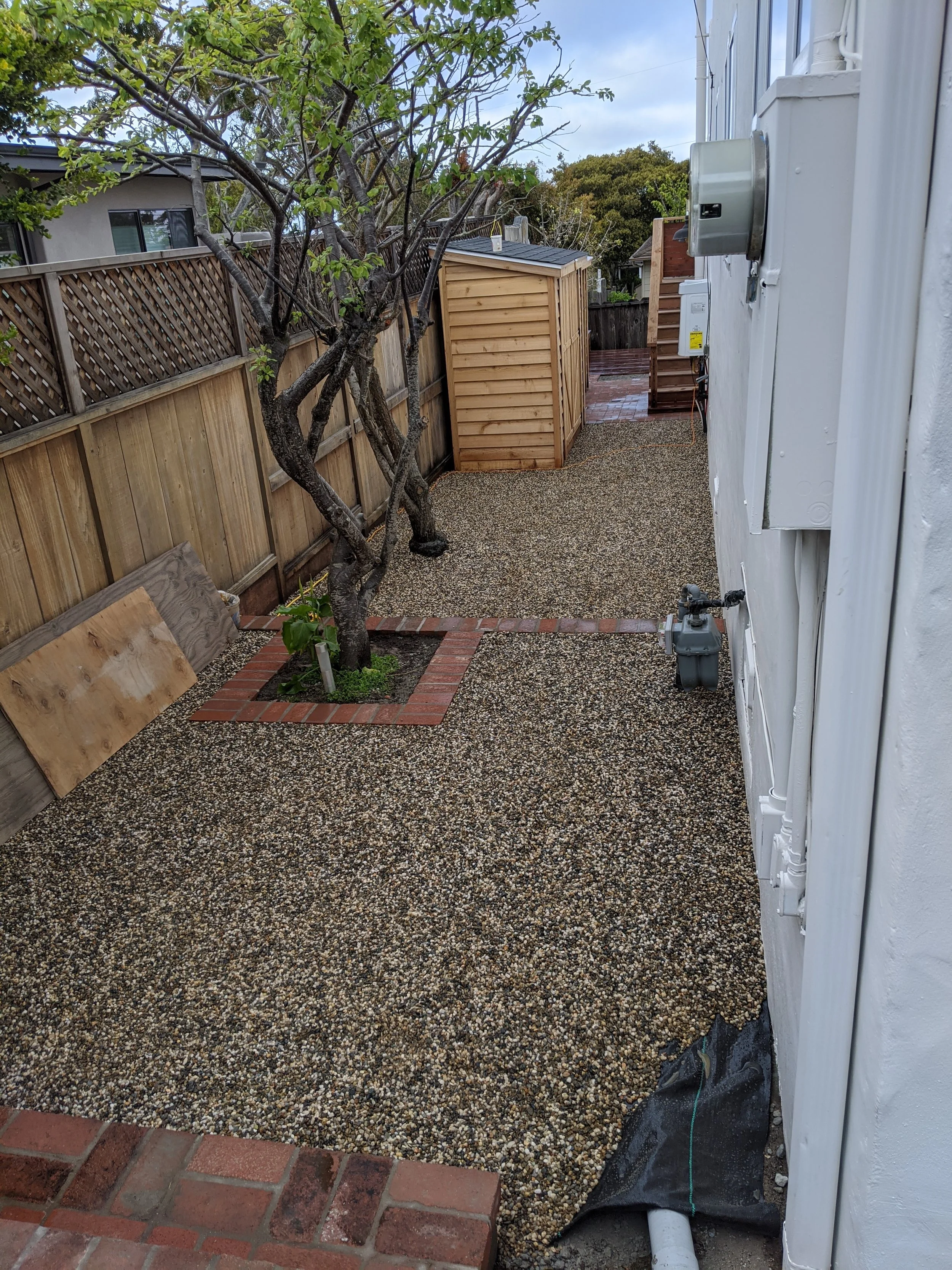 Side yard looking down to the 'Bath house.'