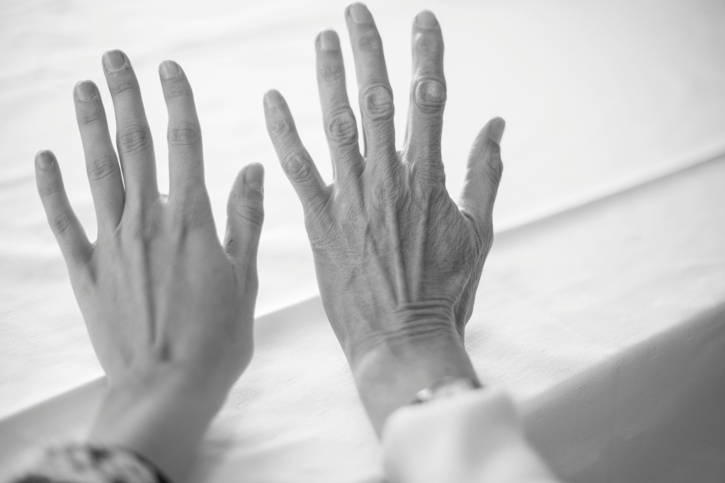 Two women's hands, one younger and one older