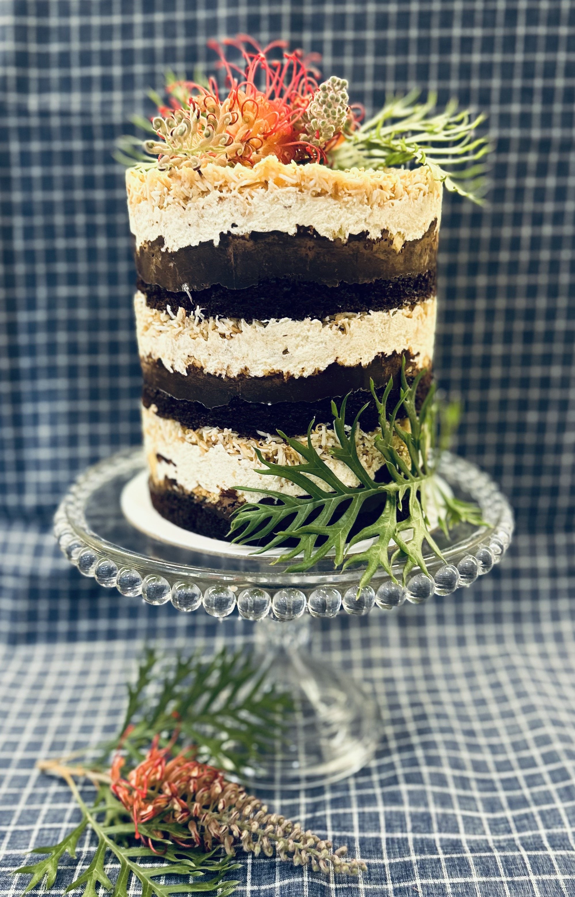 Chocolate, caramel & coconut layered cake with shortbread buttercream