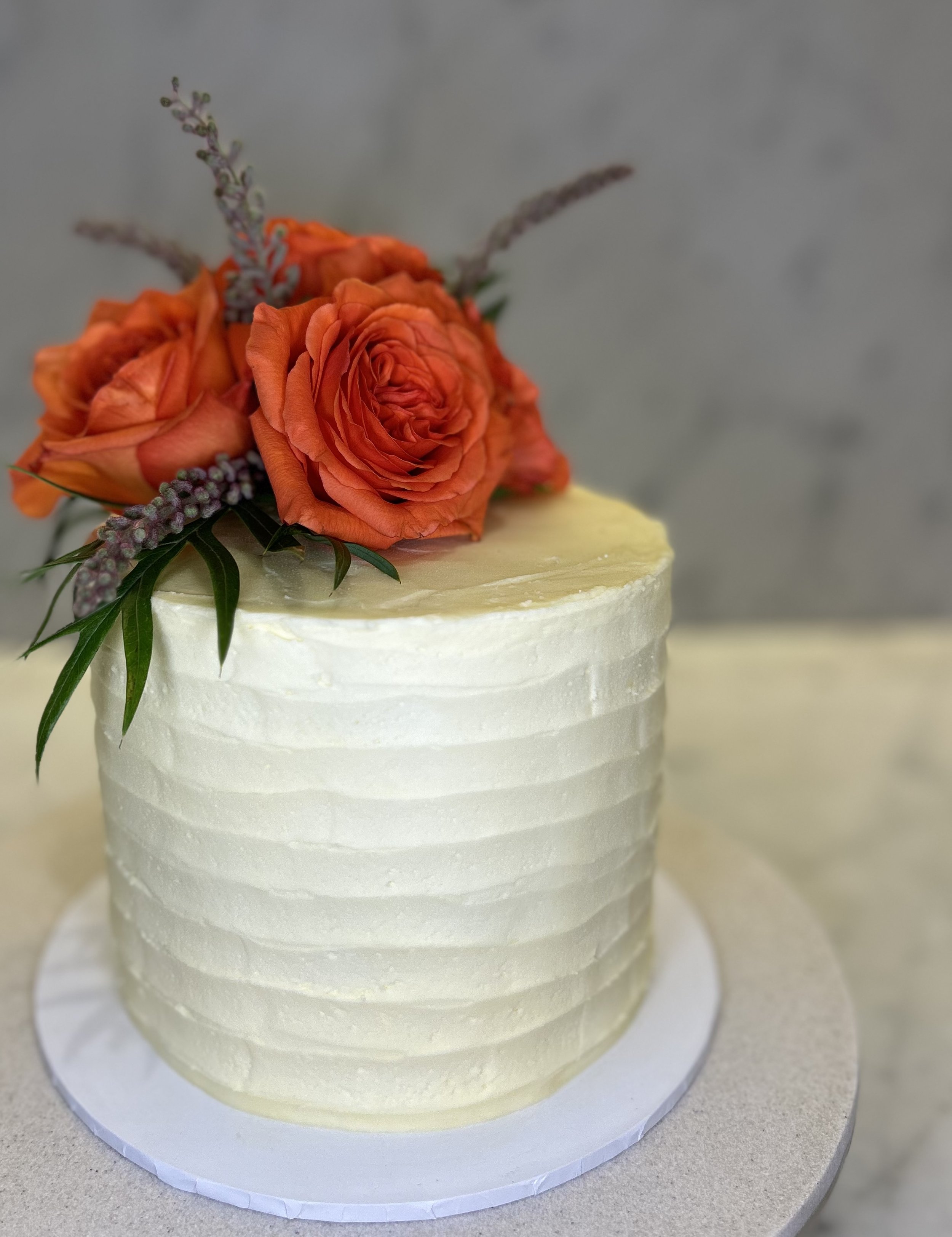 Fresh flowers, lemon cake with lemon curd & vanilla buttercream