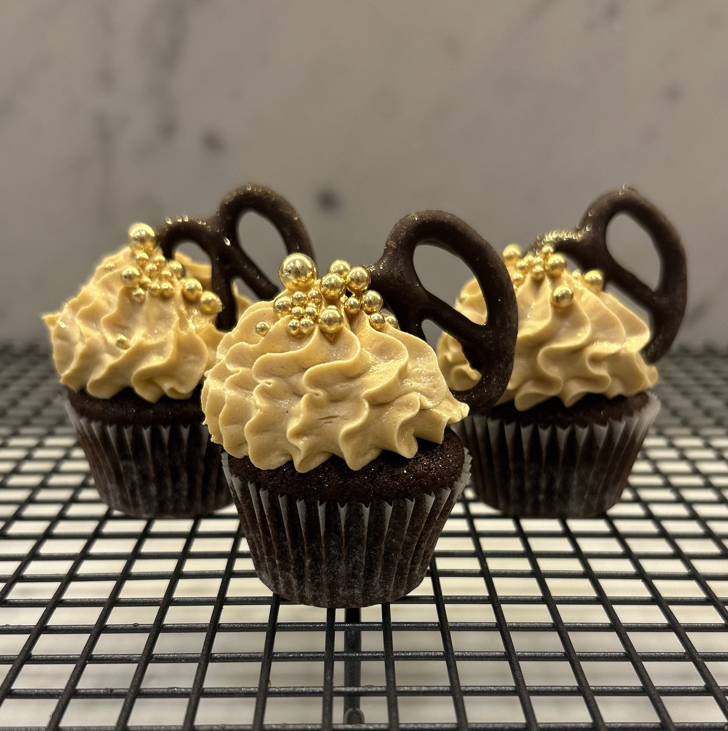 Mini dark chocolate cupcakes with salted caramel buttercream