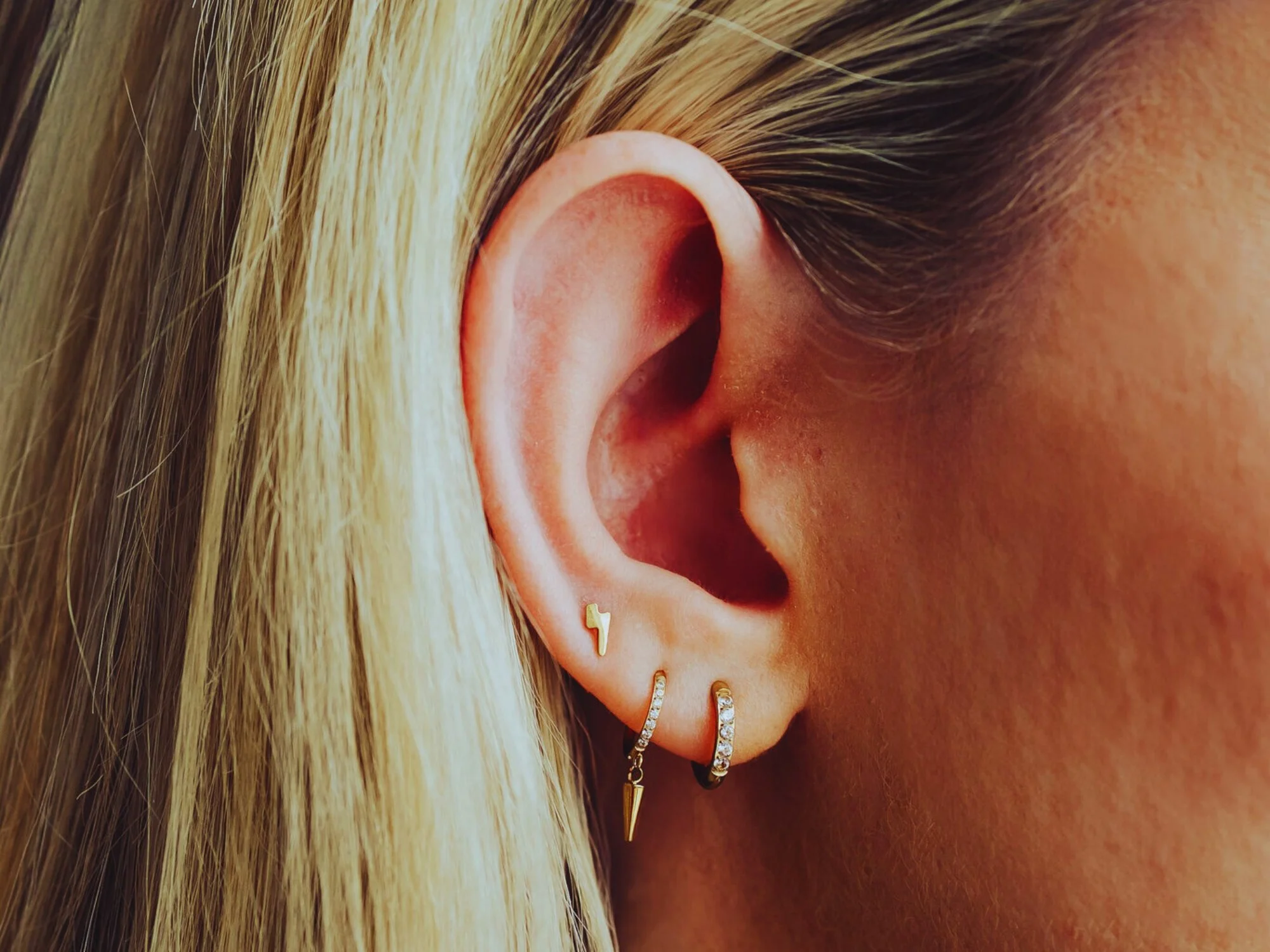 Lobe pair piercing with implant grade titanium jewellery at BLINK Beauty in Renfrew