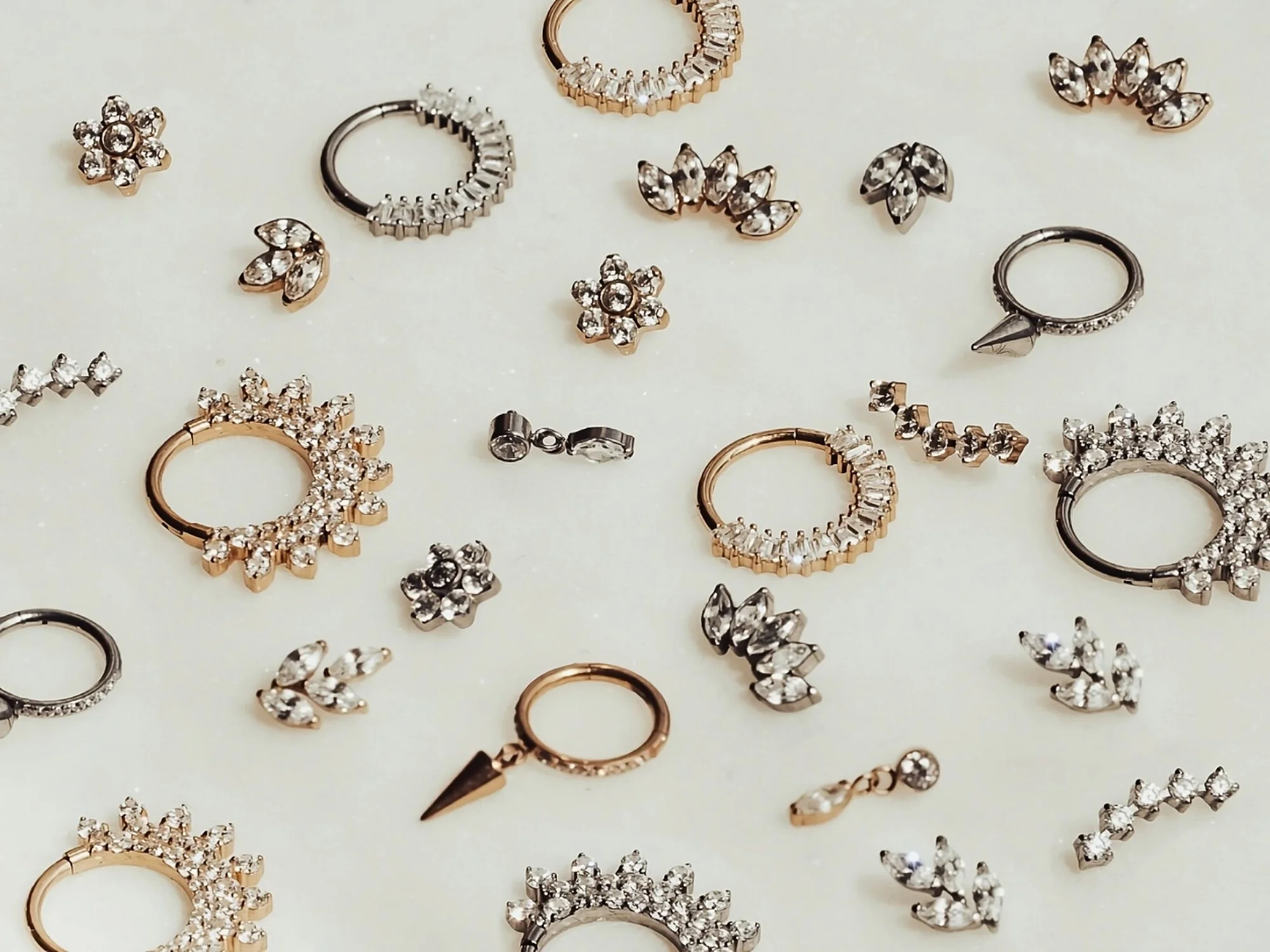 Implant Grade Titanium Jewellery in a Gold and Silver finish including skull, dagger, snake, heart jewellery.