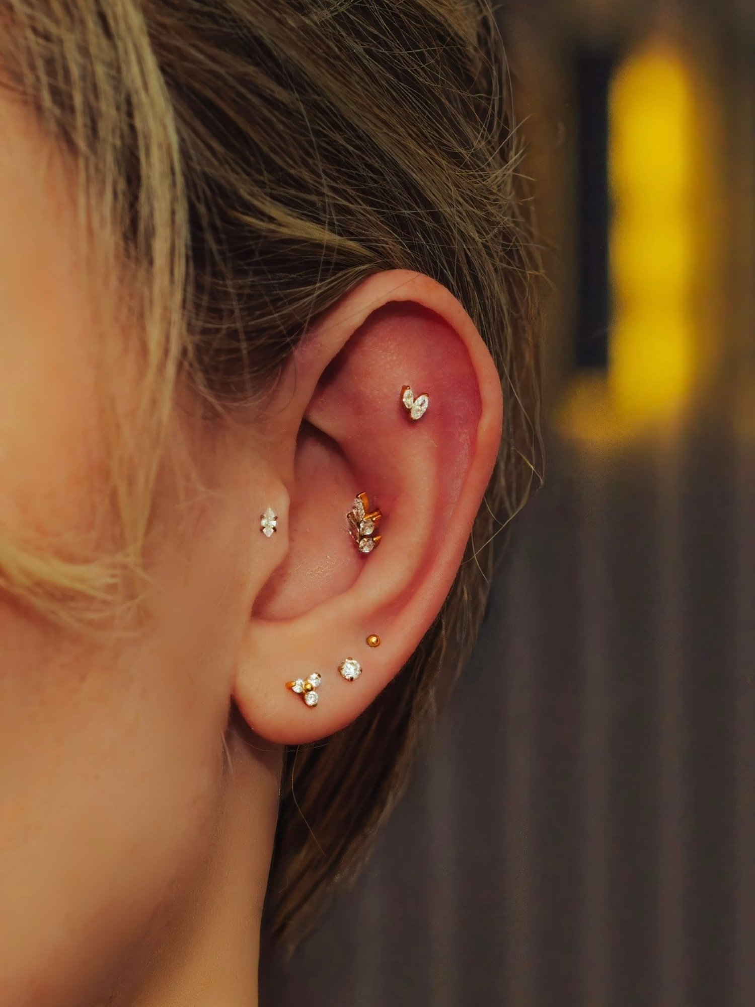 Luxury ear and lobe piercings with implant grade titanium jewellery at BLINK Beauty in Renfrew