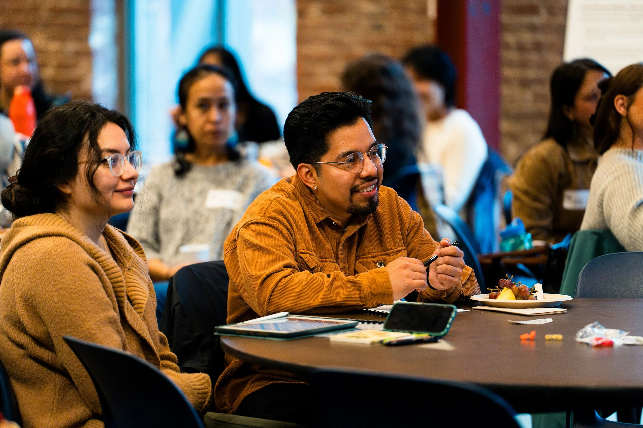 Two participants listening to speaker during 2025 BIPOC Leg