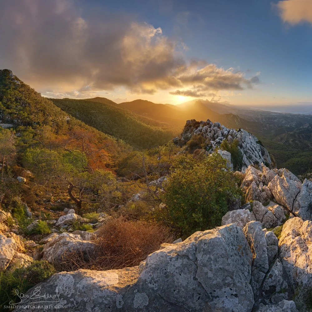 Sunset in the Kyrenia Mountains in Northern Cyprus photographed during Jan Smid’s Cyprus Photo Expedition in February 2026. Warm evening light breaks through storm clouds above the rugged Mediterranean mountain landscape.