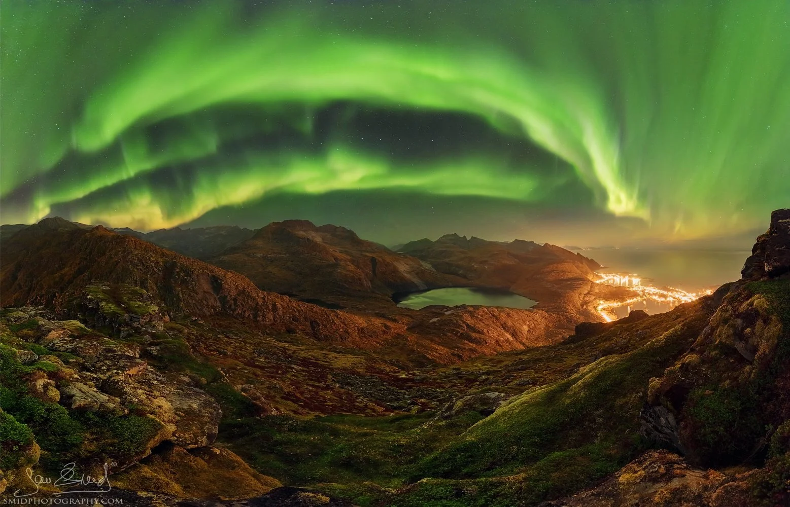 Multi-award-winning panoramic photograph "Green Bow" capturing the majestic curved mountain ridges of Lofoten. Captured at a secret, high-altitude location by Jan Smid, Master QEP, in 2017.