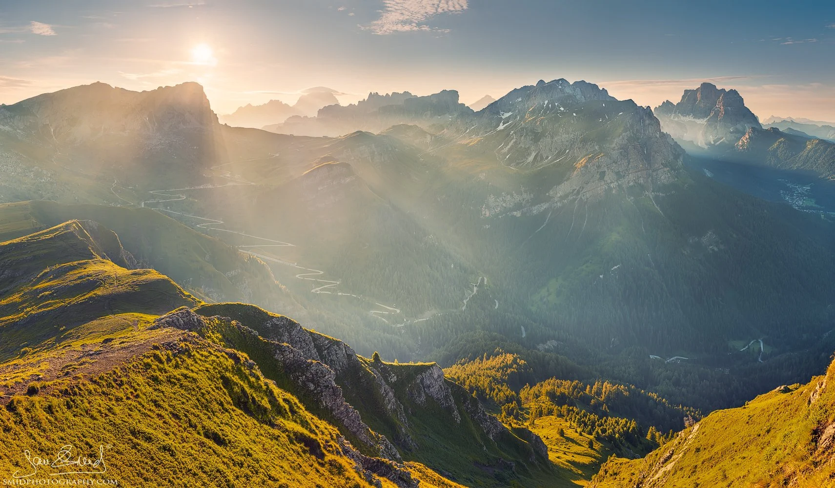 Wide summer sunrise panorama of the winding road at Passo Giau in the Dolomites, titled The Infinity Snake, by Jan Smid, Master QEP.