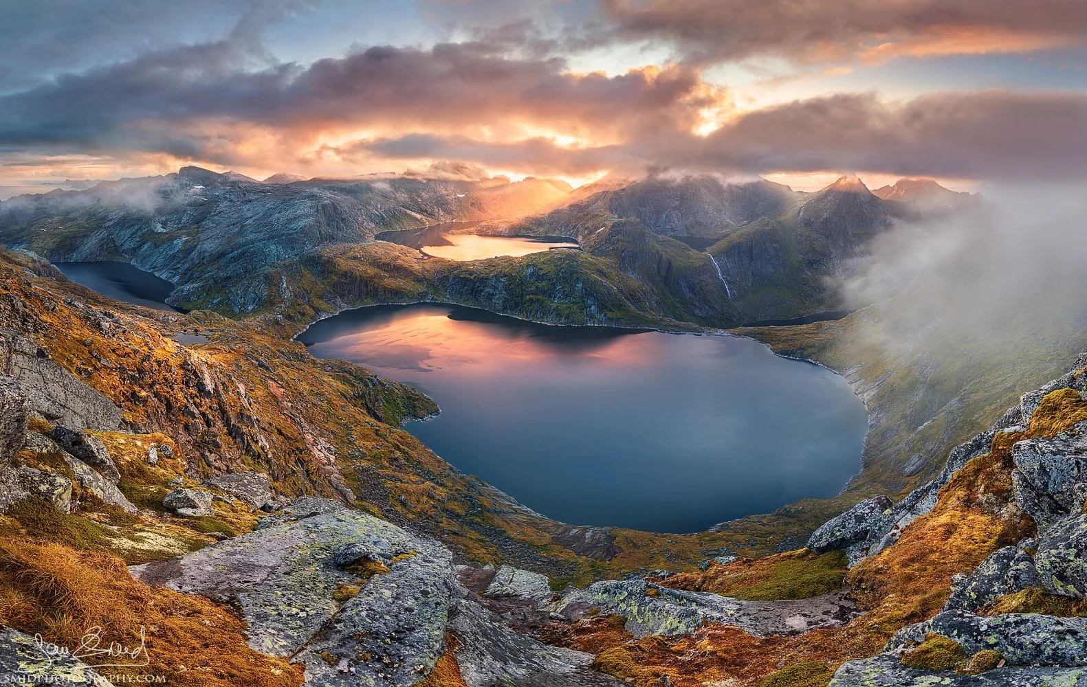 Double award-winning panoramic photograph "Hermann is Within Reach" showing dramatic clouds over arctic lakes and peaks. Captured by Jan Smid, Master QEP, in 2019.