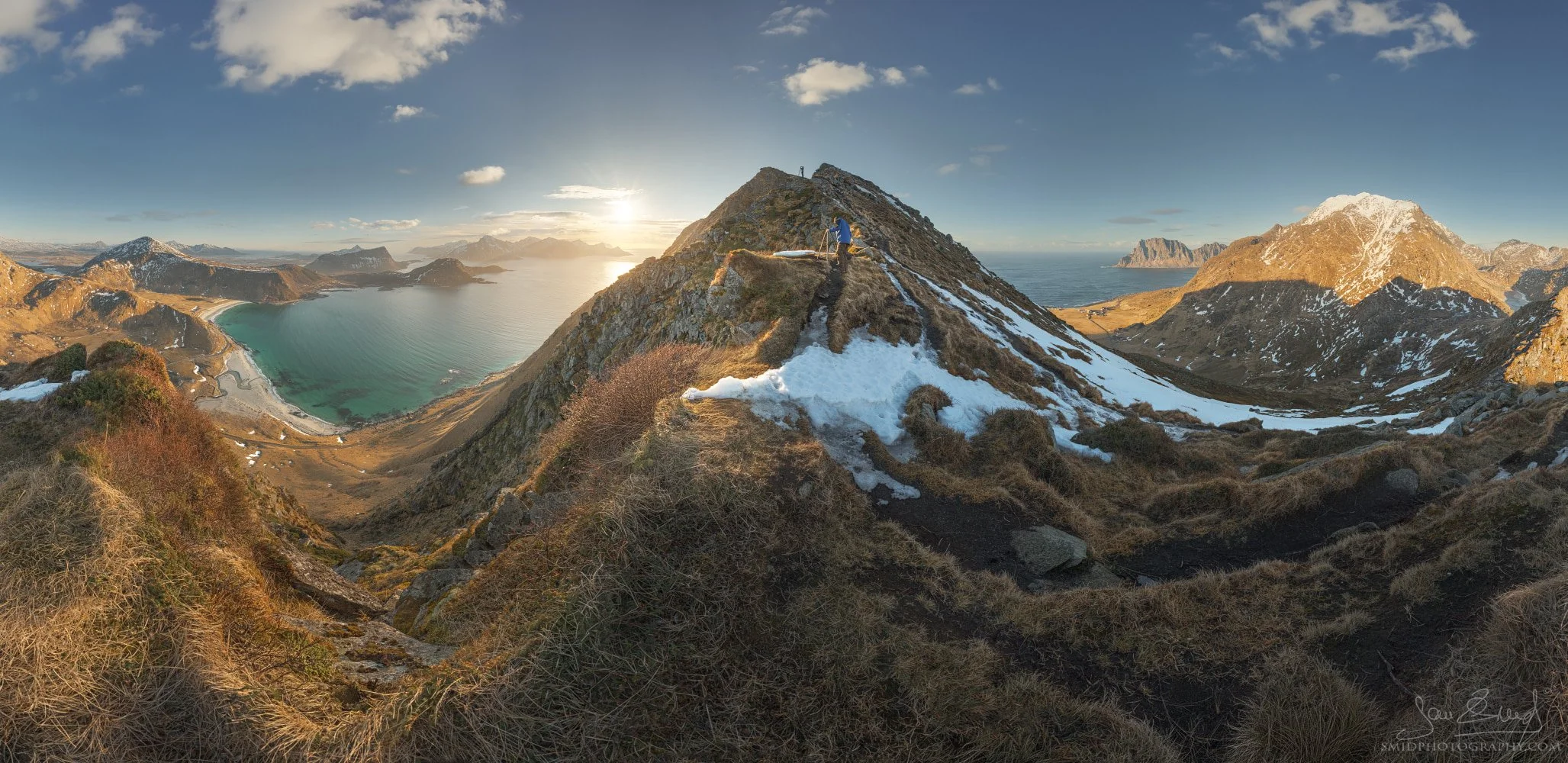 Full 360-degree sunset panorama of The Golden Ridge of Mannen, Lofoten, featuring two expedition participants, captured by Jan Smid Master QEP.