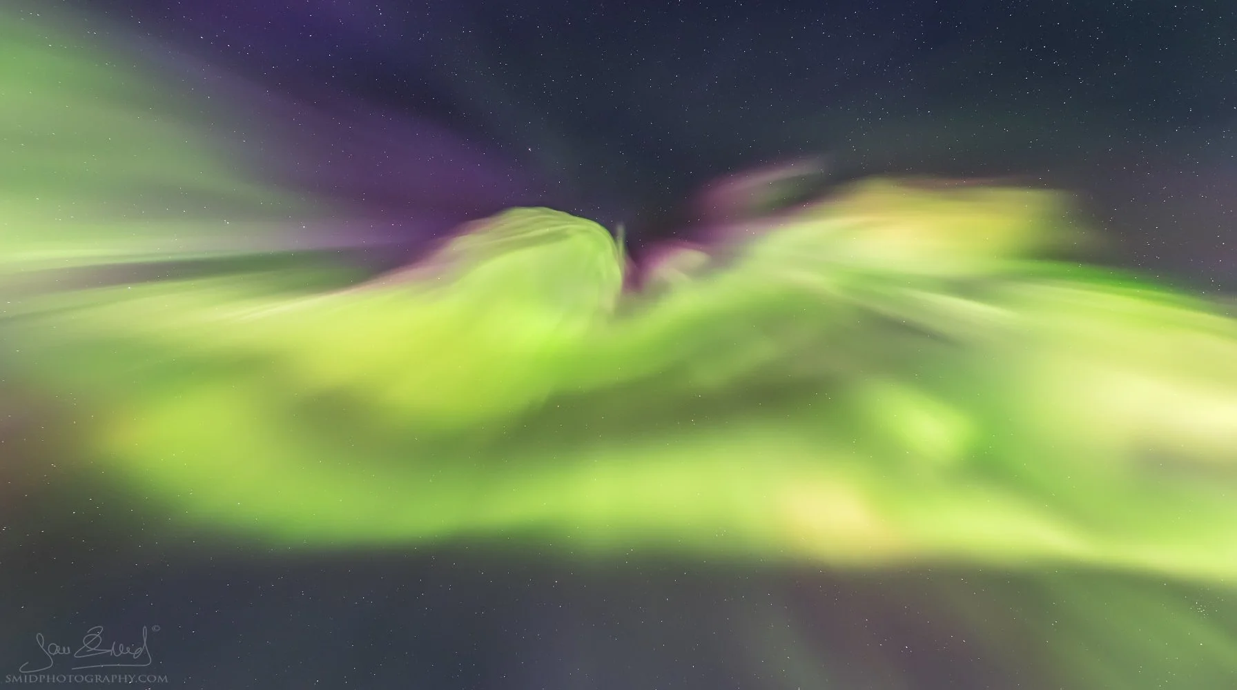 Aurora Borealis visible in the night sky over Lofoten Islands, captured during our early Lofoten Photo Expedition in 2016 by Jan Smid, Master QEP.