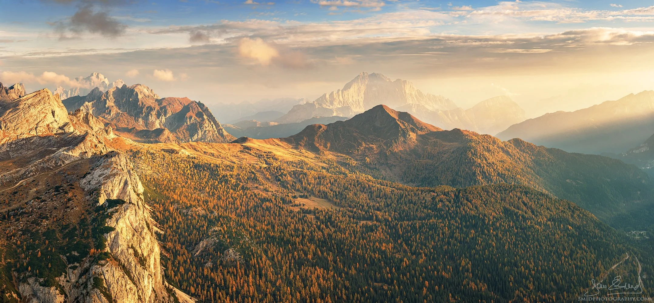 Wide autumn landscape of a hidden location in the Dolomites with misty mountains and golden light, titled Misty Autumn, by Jan Smid, Master QEP.