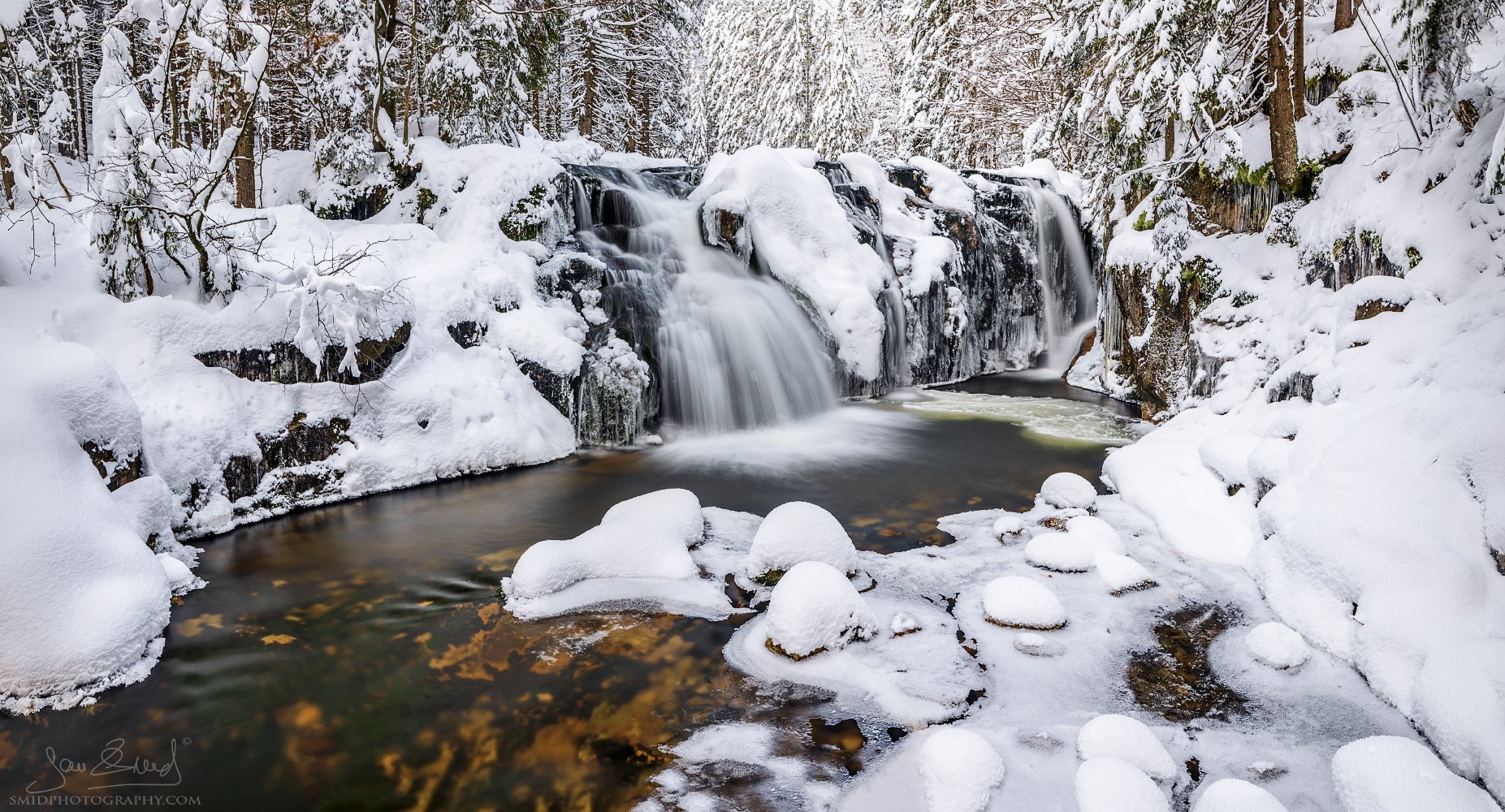 Detailed shot of the frozen Maly Labsky waterfall in Krkonose Mountains, titled The Winter Hug, by Jan Smid, Master QEP.
