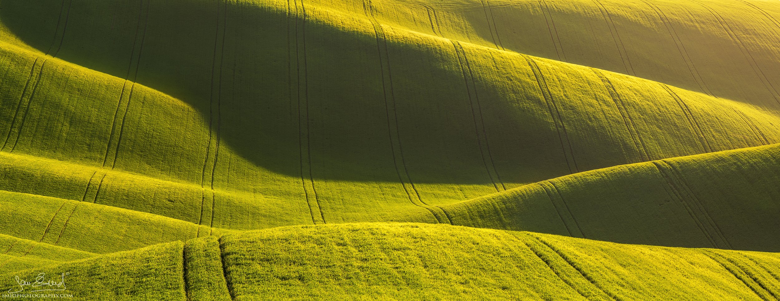 Award-winning telephoto landscape of purple sunset light over rolling fields in South Moravia, titled Evening Velvet, by Jan Smid, Master QEP.