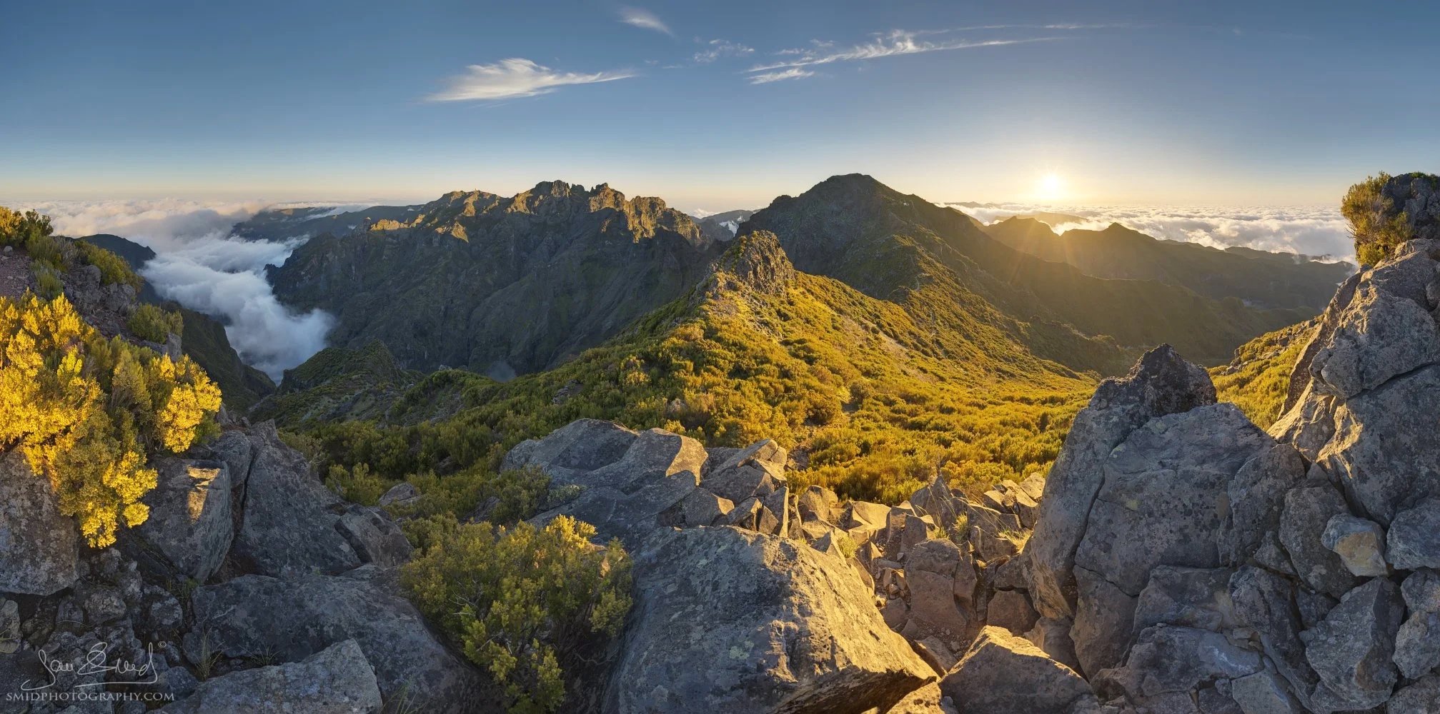 A panoramic sunset view over the clouds from a trail near Pico Ruivo, Madeira, captured during Jan Smid's landscape photography expedition.