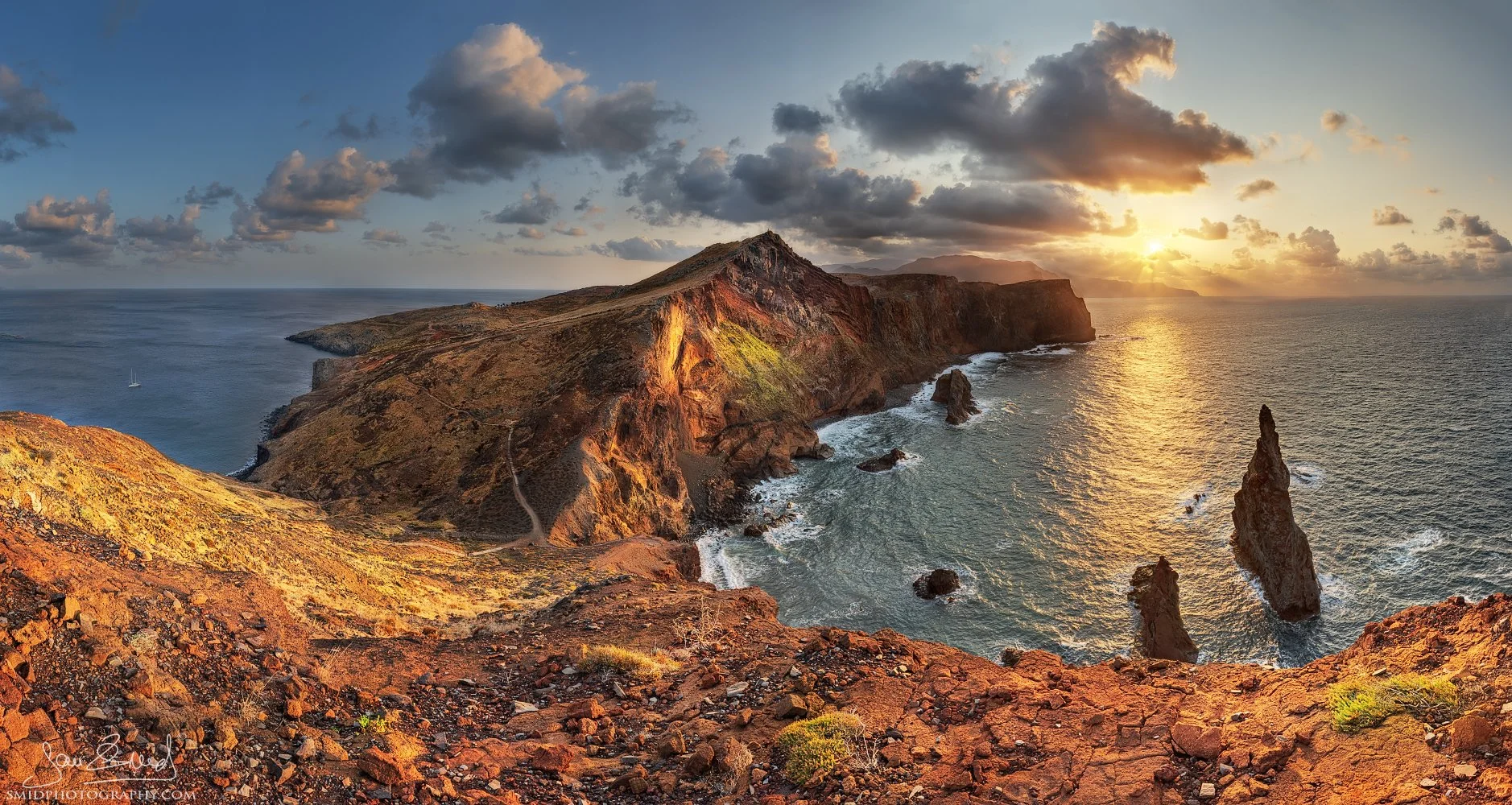Unique panoramic landscape photograph "Dragon's Tooth" at Ribeira da Janela, Madeira. Captured from an unconventional perspective looking back towards the island during sunset. Shot by Jan Smid, Master QEP, during a 2023 photography expedition.