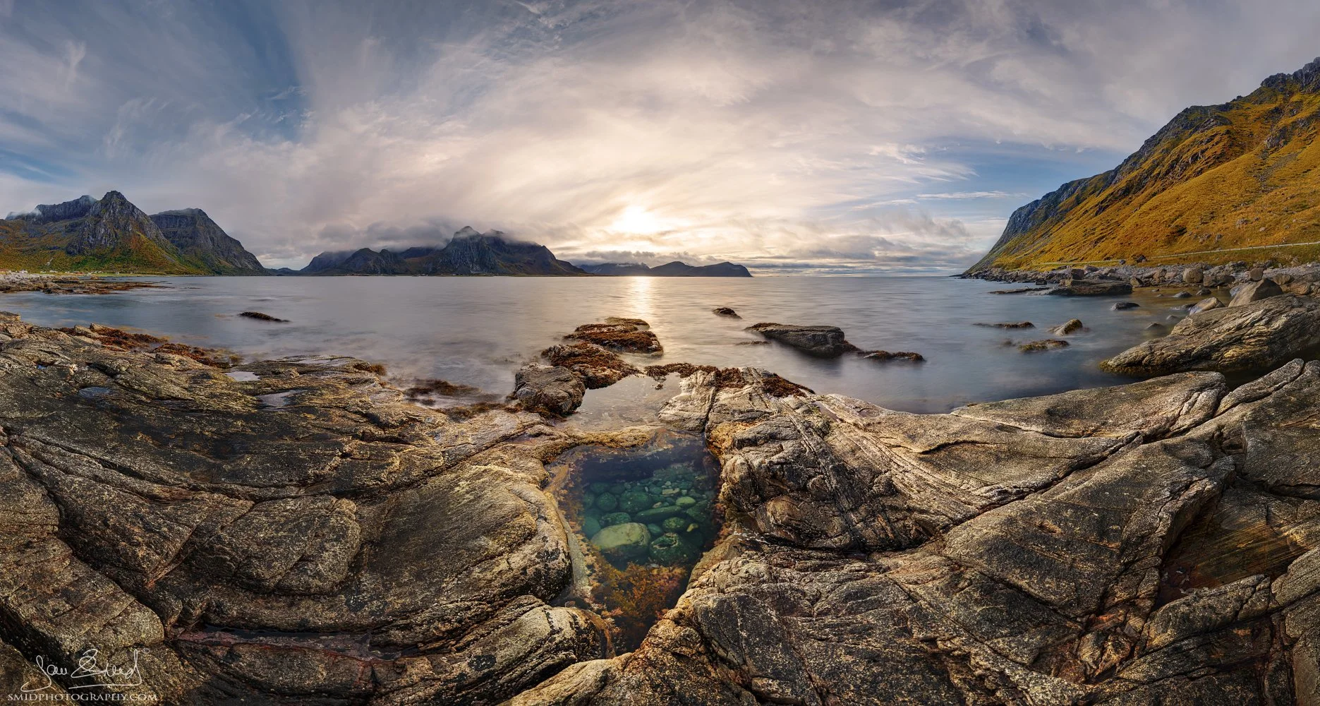 Panoramic sunset photograph "Heart of Stone" featuring a unique heart-shaped rock formation on the shores of Vareid Beach, Lofoten. Captured by Jan Smid, Master QEP, in 2023.
