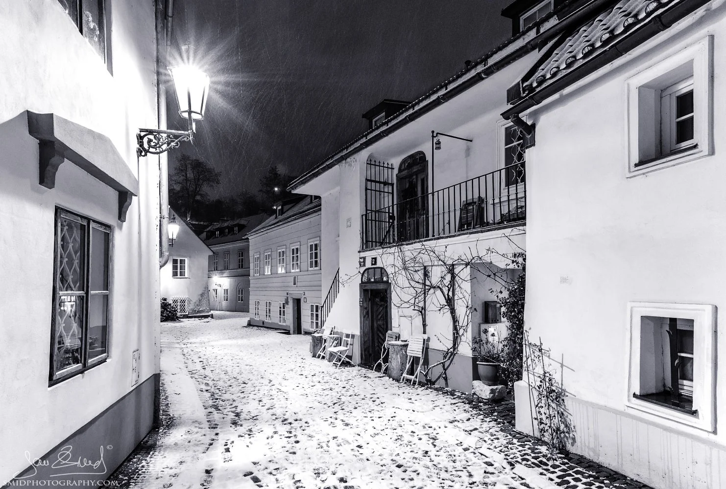 Atmospheric street photography titled "The New Photo World" in the Nový Svět district of Prague. Historic narrow streets of Hradčany captured by Jan Smid, Master QEP, in 2019. Quiet, picturesque morning in the old town.