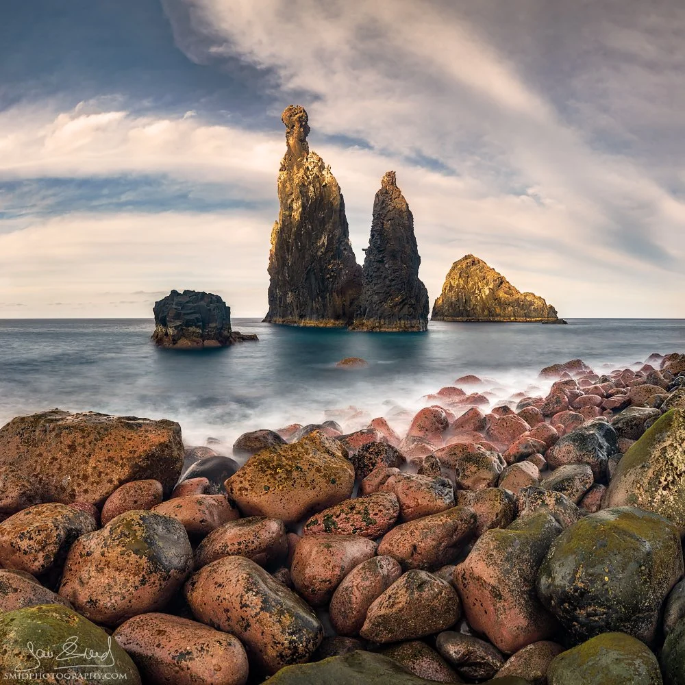 Dramatic panoramic landscape photograph "Two Fingers" featuring two prominent volcanic sea stacks rising from the turbulent Atlantic waves in Madeira. Captured by Jan Smid, Master QEP, in 2018.