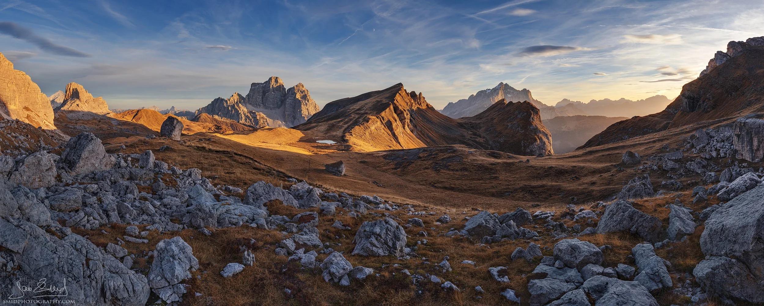 Warm golden light over Monte Pelmo in autumn – wide panorama from Forcella Giau during our Dolomites photo expedition with Jan Šmíd Master QEP