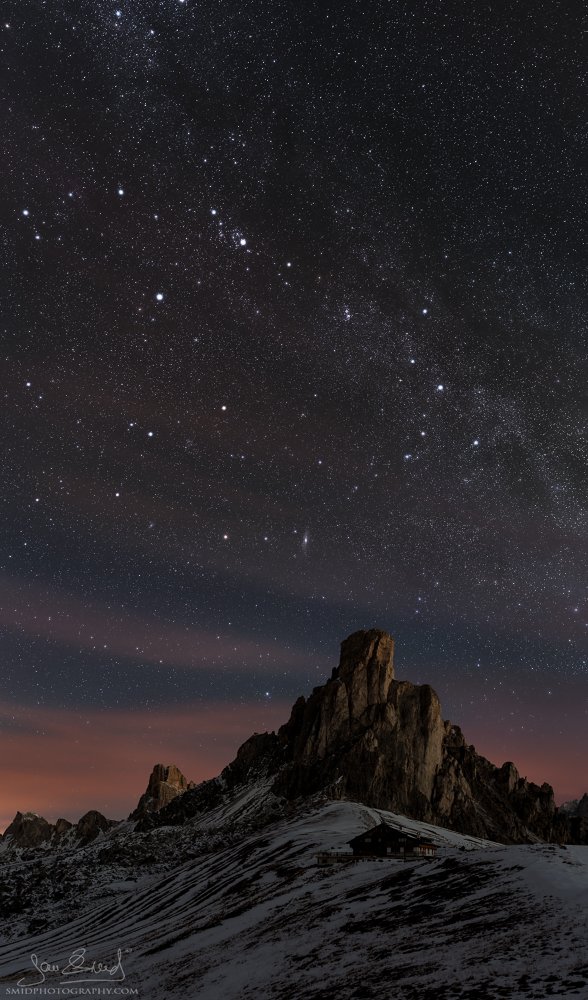 Vertical night photo of the Passo Giau mountain pass in the Dolomites with the Milky Way, titled Night Sentinel, by Jan Smid, Master QEP.