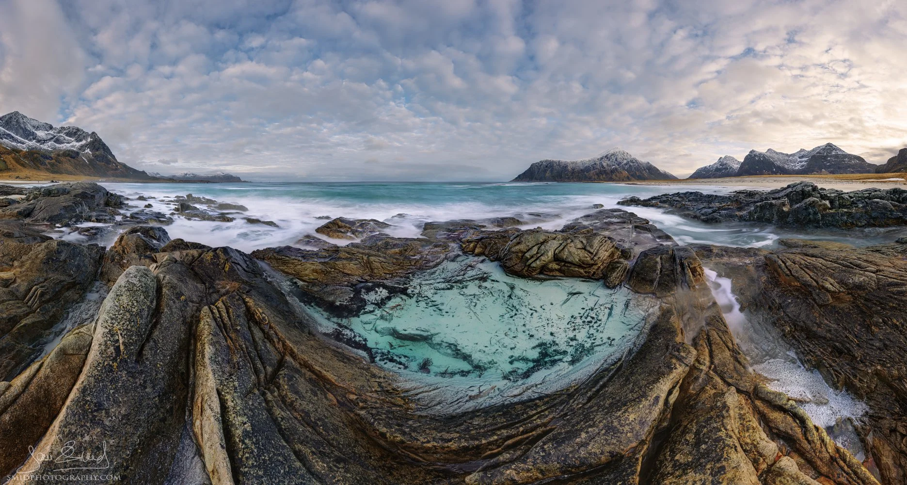 Panoramic winter landscape photograph "Between Sea and Silence" capturing the ethereal stillness and coastal beauty of Skagsanden Beach, Lofoten. Captured by Jan Smid, Master QEP, in 2025.