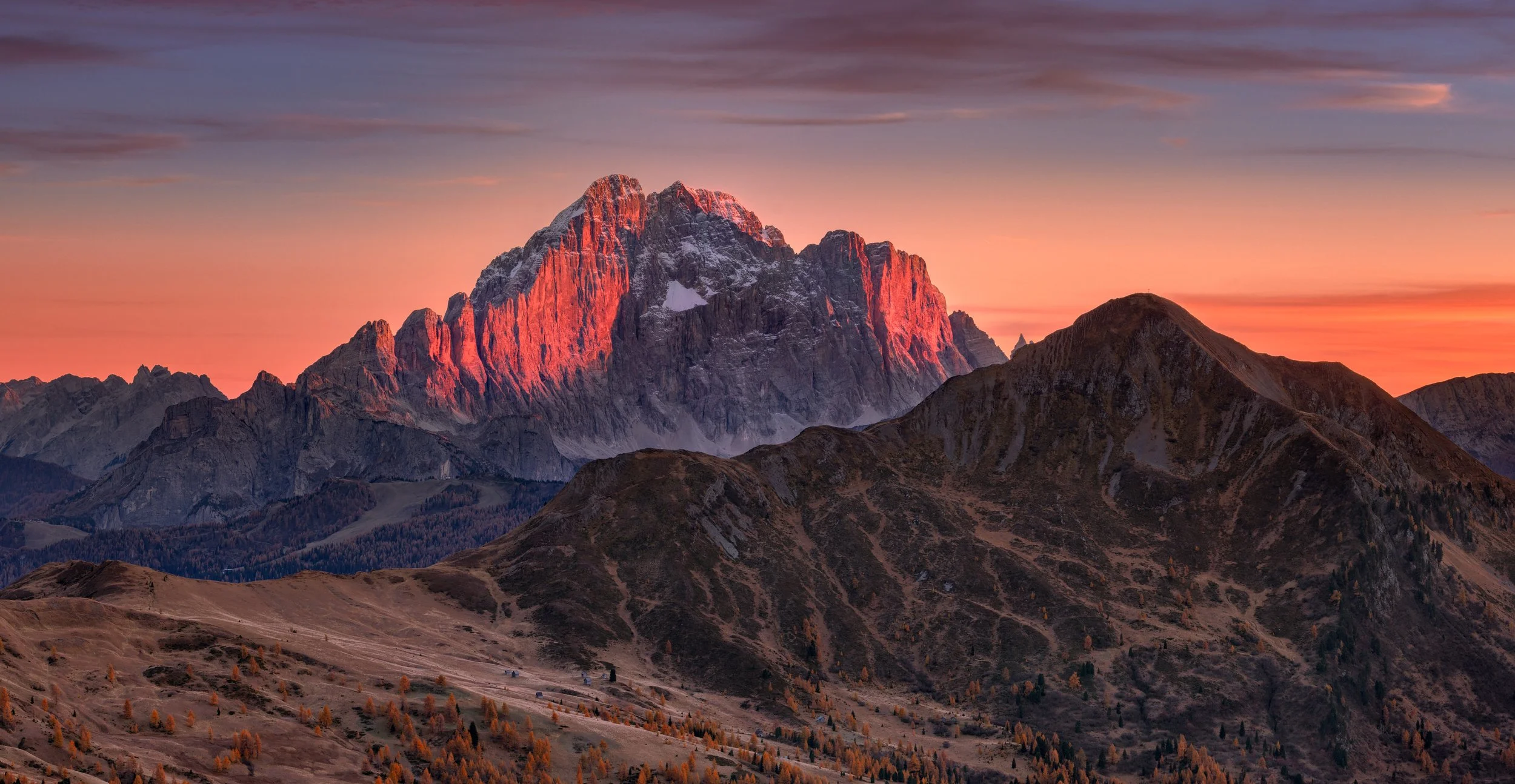 Hero image for the landscape photography blog "Behind the Lens" featuring a glowing mountain peak in the Dolomites by Jan Smid, Master QEP.