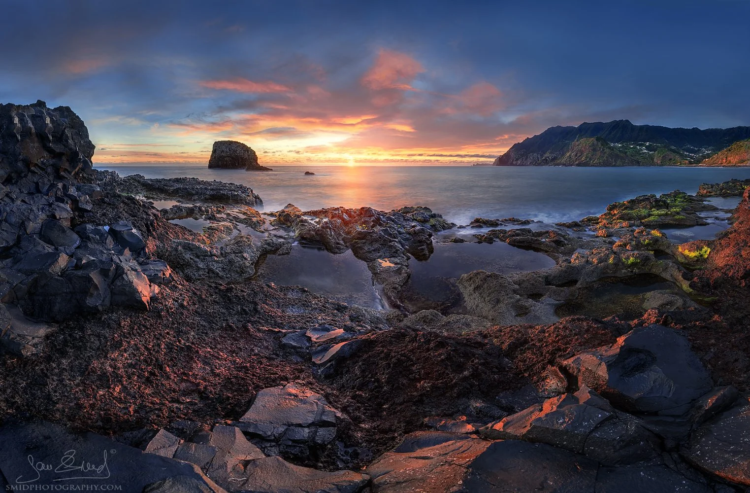 Unique panoramic landscape photograph "Sunrise on the Atlantic" featuring a hidden volcanic coastline and natural rock pools in Madeira at sunrise. Captured by Jan Smid, Master QEP, during a 2021 photography expedition.