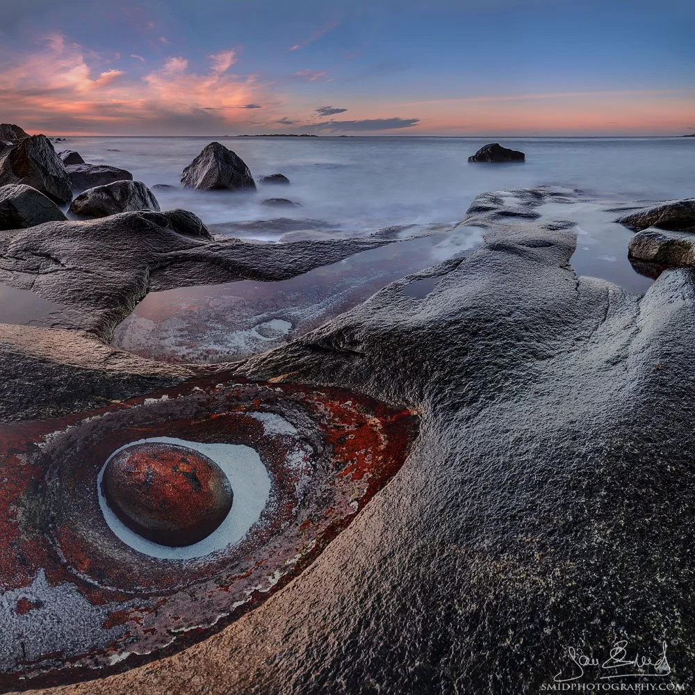 High-end panoramic photograph "The Eye II" capturing the legendary Dragon's Eye rock formation at Uttakleiv Beach, Lofoten. Captured with advanced winter textures by Jan Smid, Master QEP, in 2018.