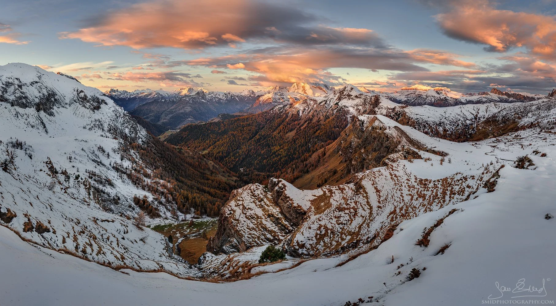 Sunrise panorama of snowy Dolomites and autumn forests titled "Goodbye Autumn, Hello Winter" by Jan Smid, Master QEP.