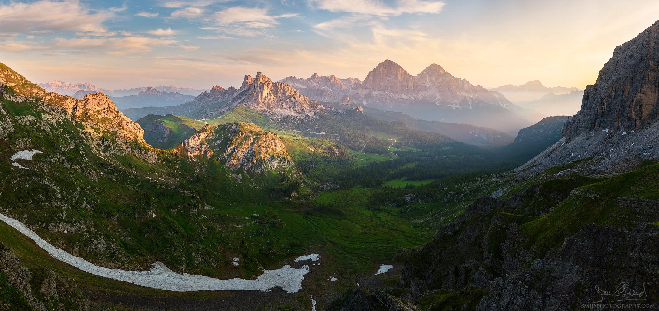 Wide summer sunrise panorama of Passo Giau in the Dolomites with a lingering snow patch, titled A Snowy Wave, by Jan Smid, Master QEP.
