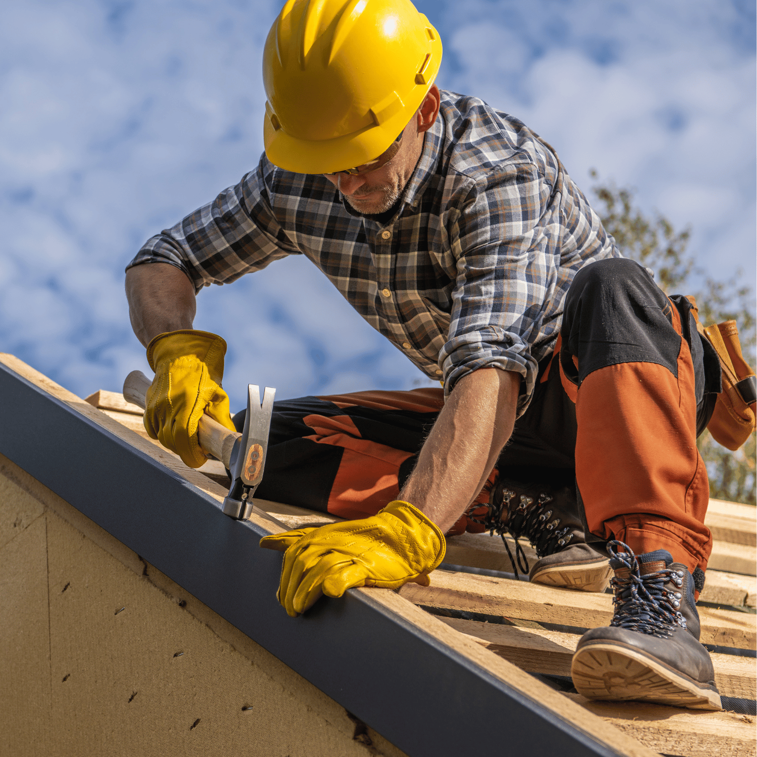 Professional contractor performing roofing installation and maintenance work on a residential property.