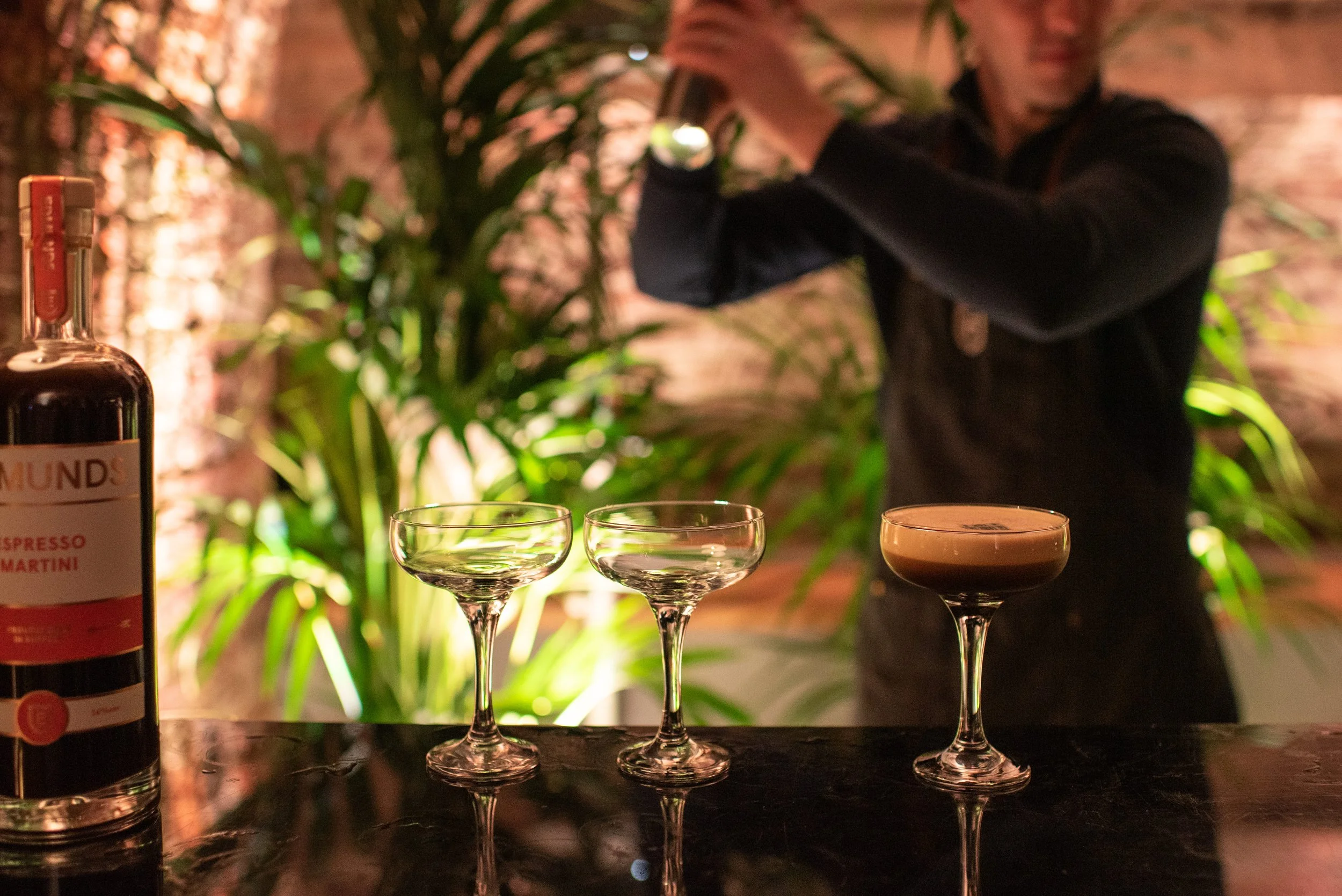 Wedding bartender making espresso martinis