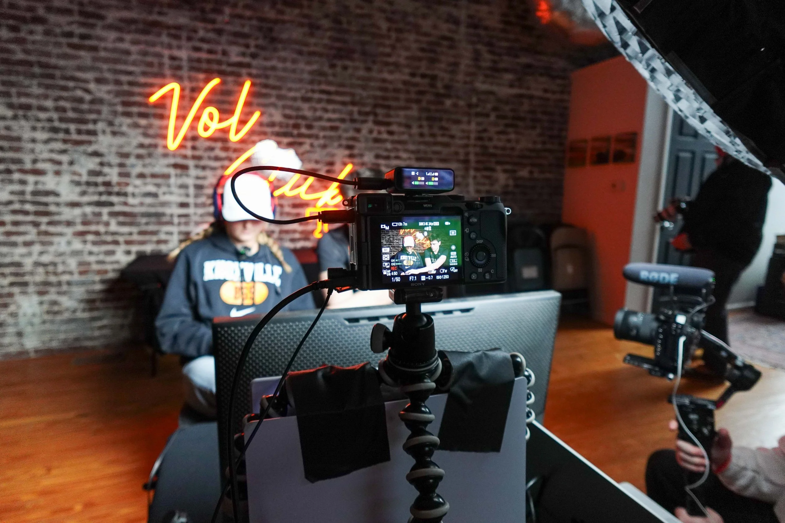 Two Tennessee athletes playinga  video game while being filmed