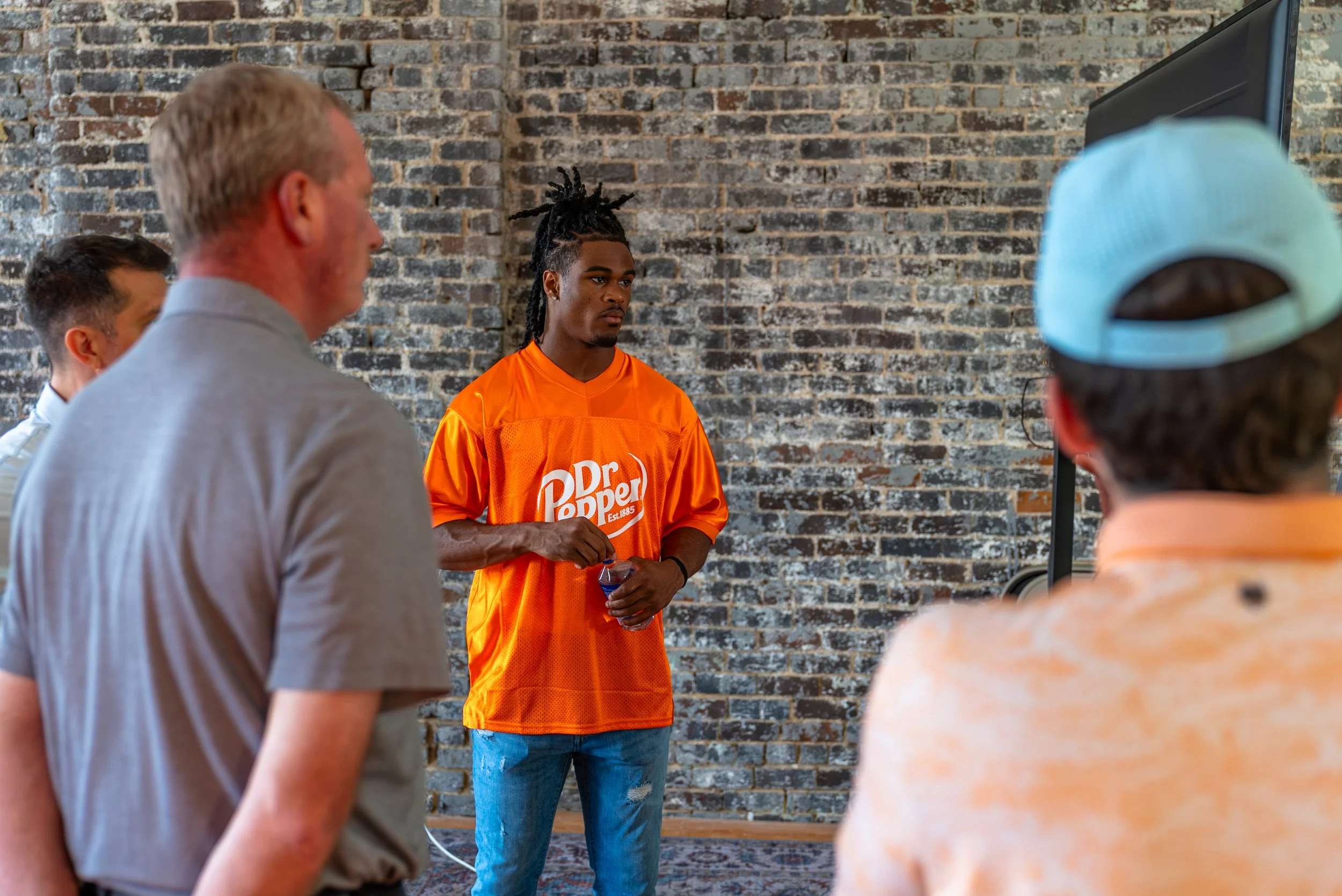 Jermod McCoy in a Dr. Pepper jersey